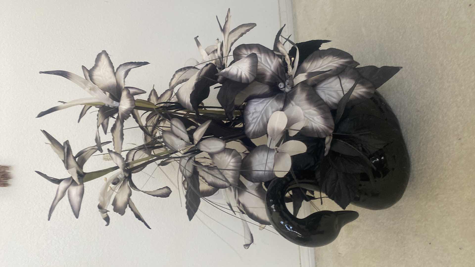 Photo 1 of BLACK CERAMIC SWAN WITH FAUX FLORALS OVERALL 19“ x 29“