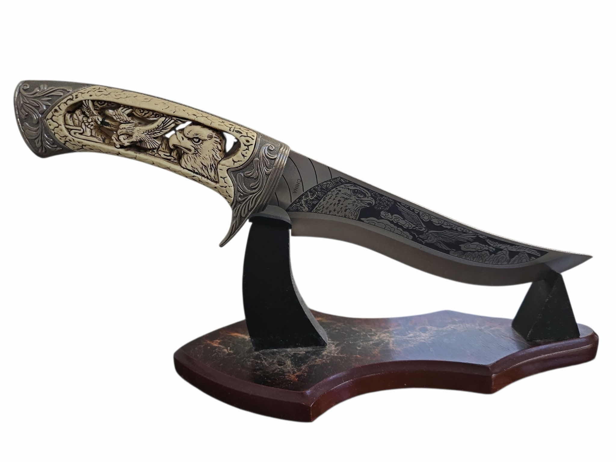 Photo 1 of CARVED HUNTING KNIFE ON STAND 12”