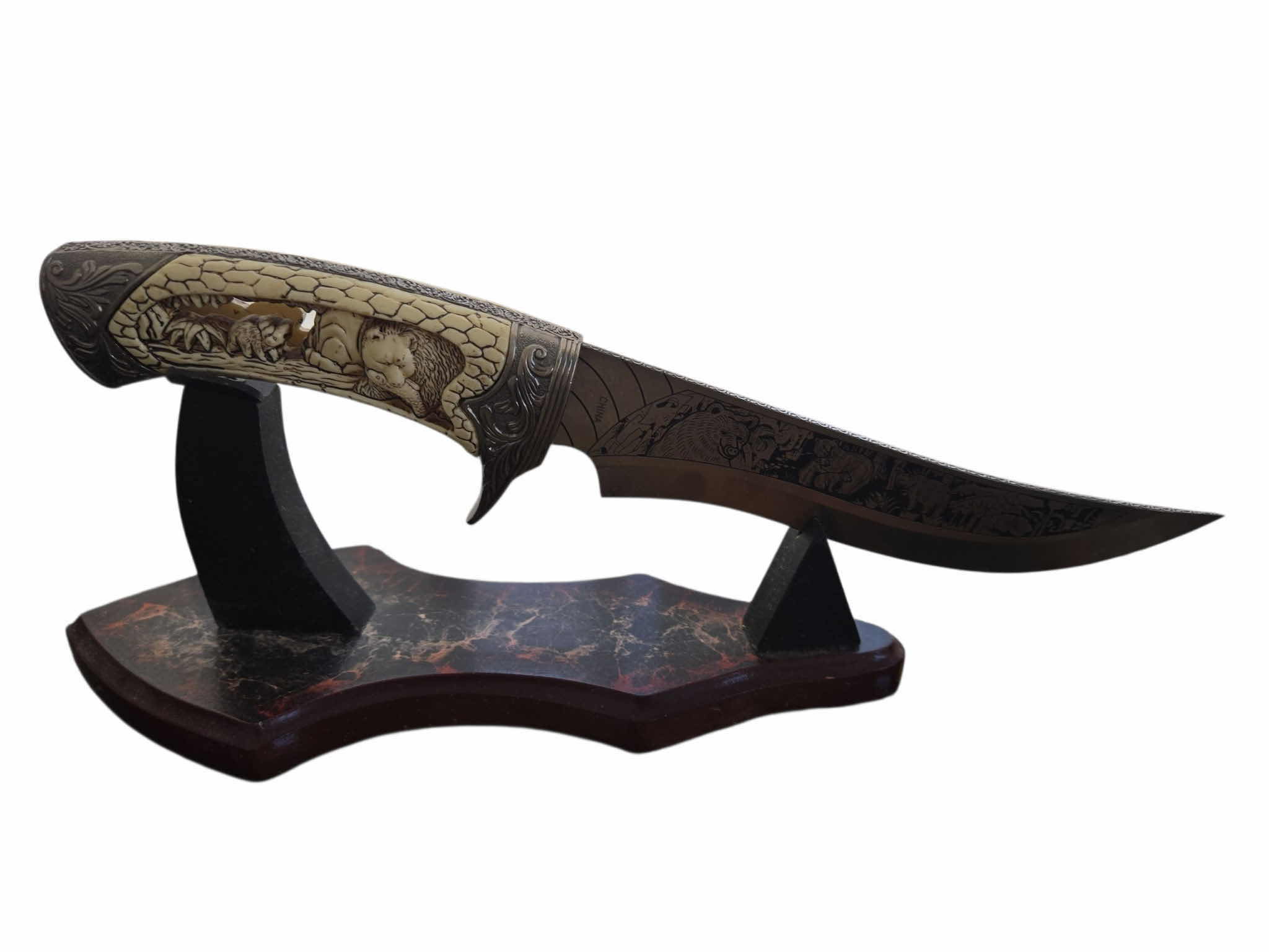 Photo 1 of CARVED HUNTING KNIFE ON STAND 12”