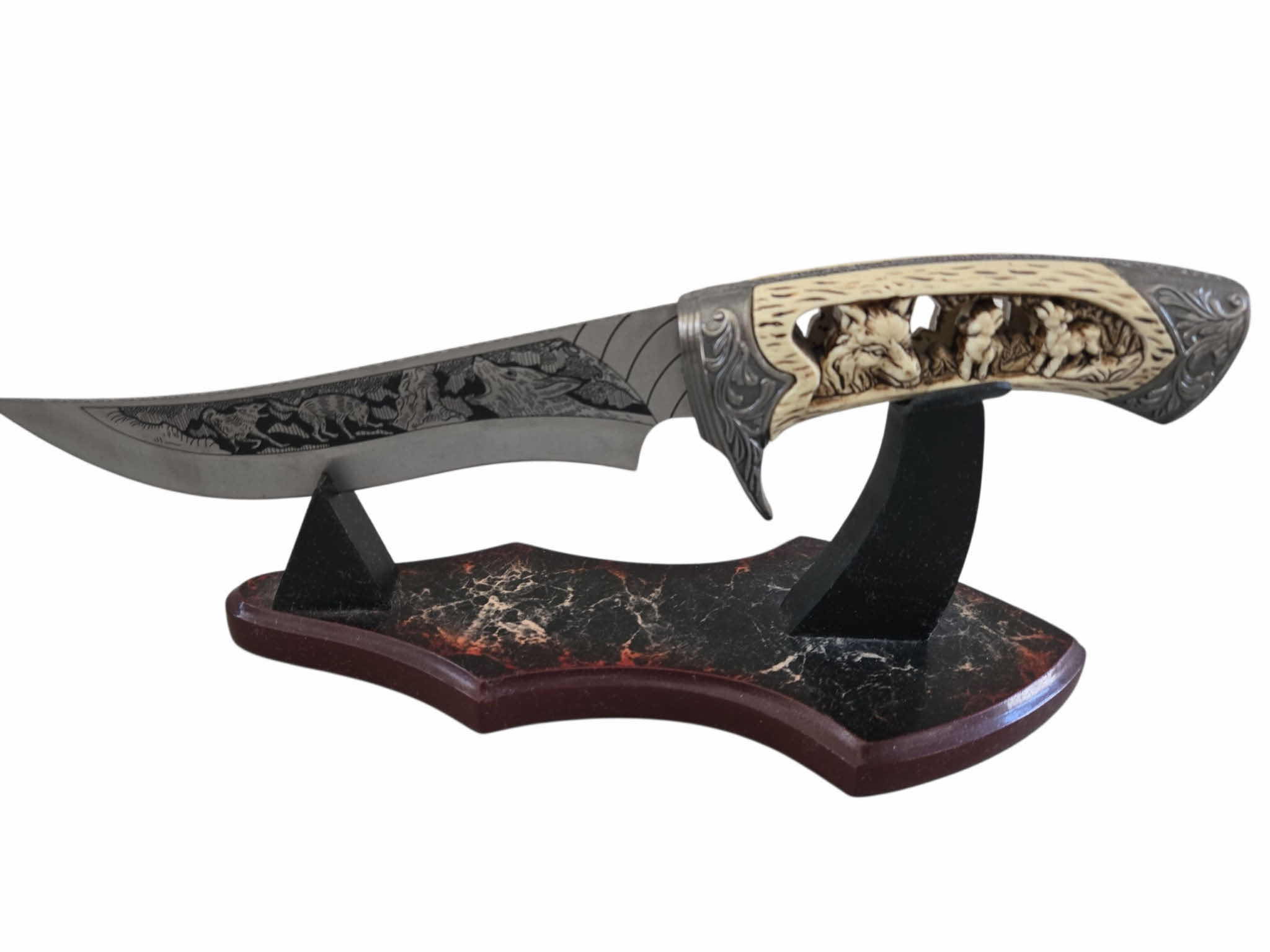 Photo 1 of CARVED HUNTING KNIFE ON STAND 12”