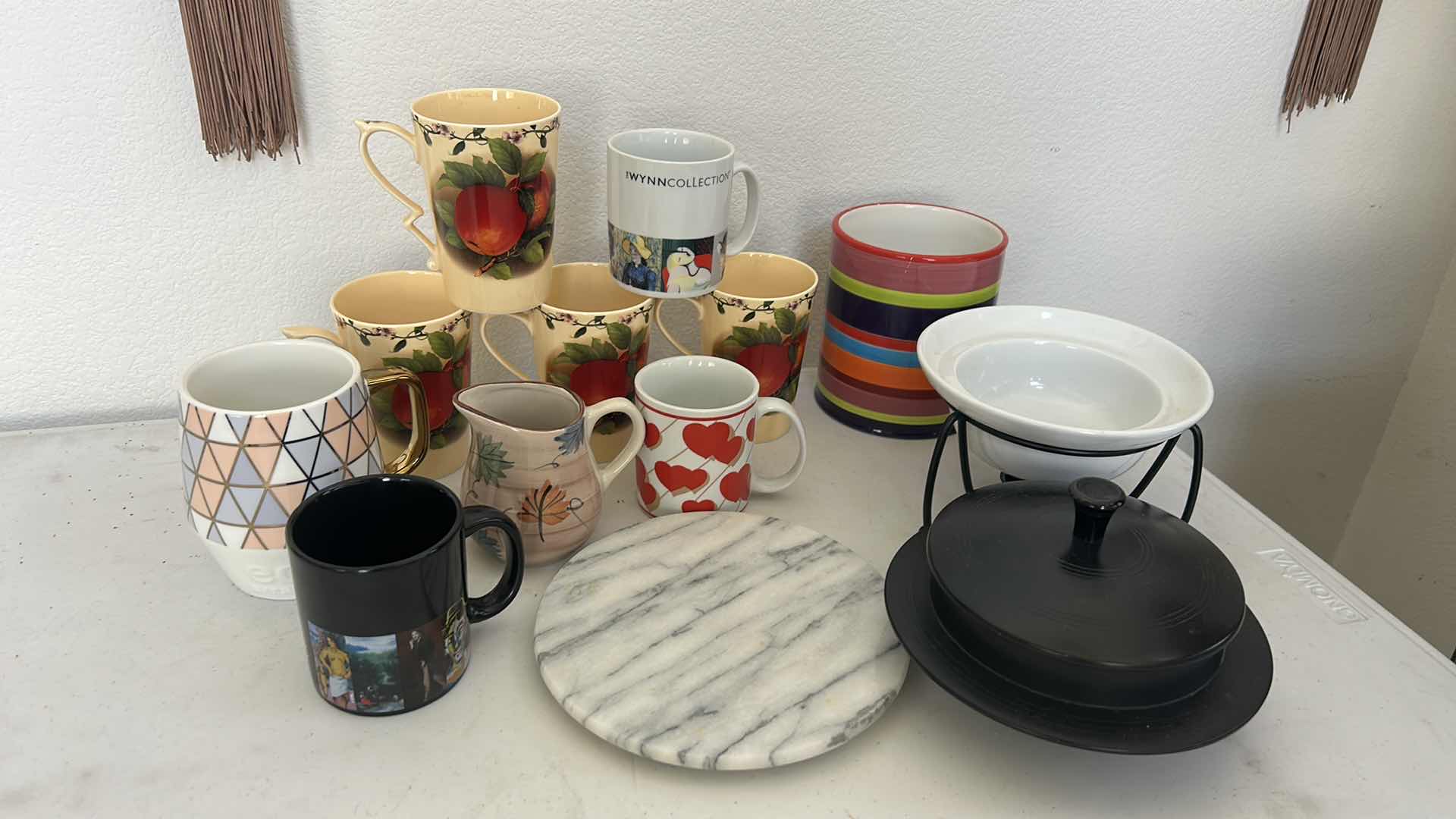 Photo 1 of KITCHEN / ENTERTAINMENT/ SERVING ITEMS- COFFEE MUGS , WINE HOLDER, TRIVIT AND MORE