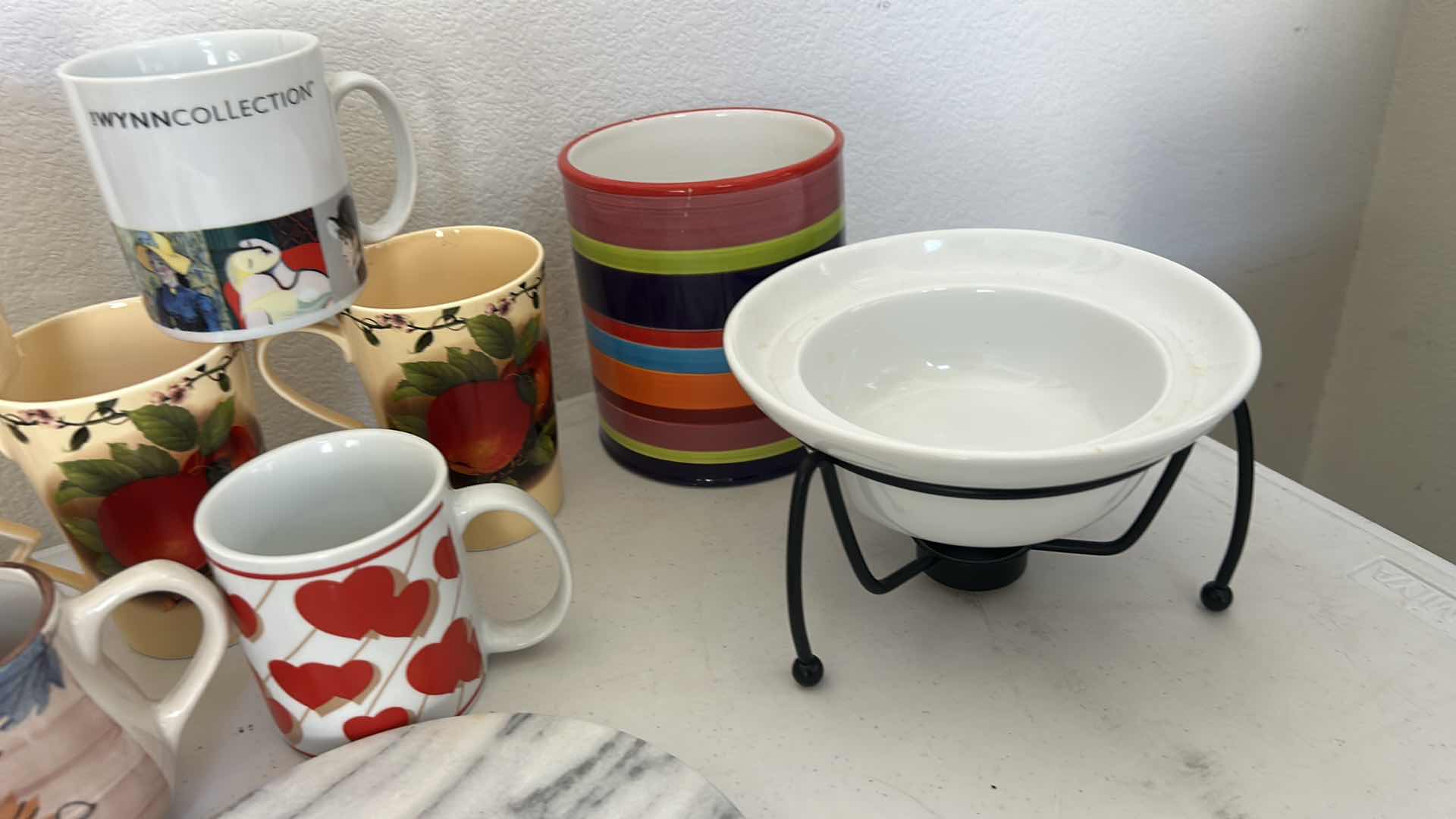 Photo 1 of KITCHEN / ENTERTAINMENT/ SERVING ITEMS- COFFEE MUGS , WINE HOLDER, TRIVIT AND MORE