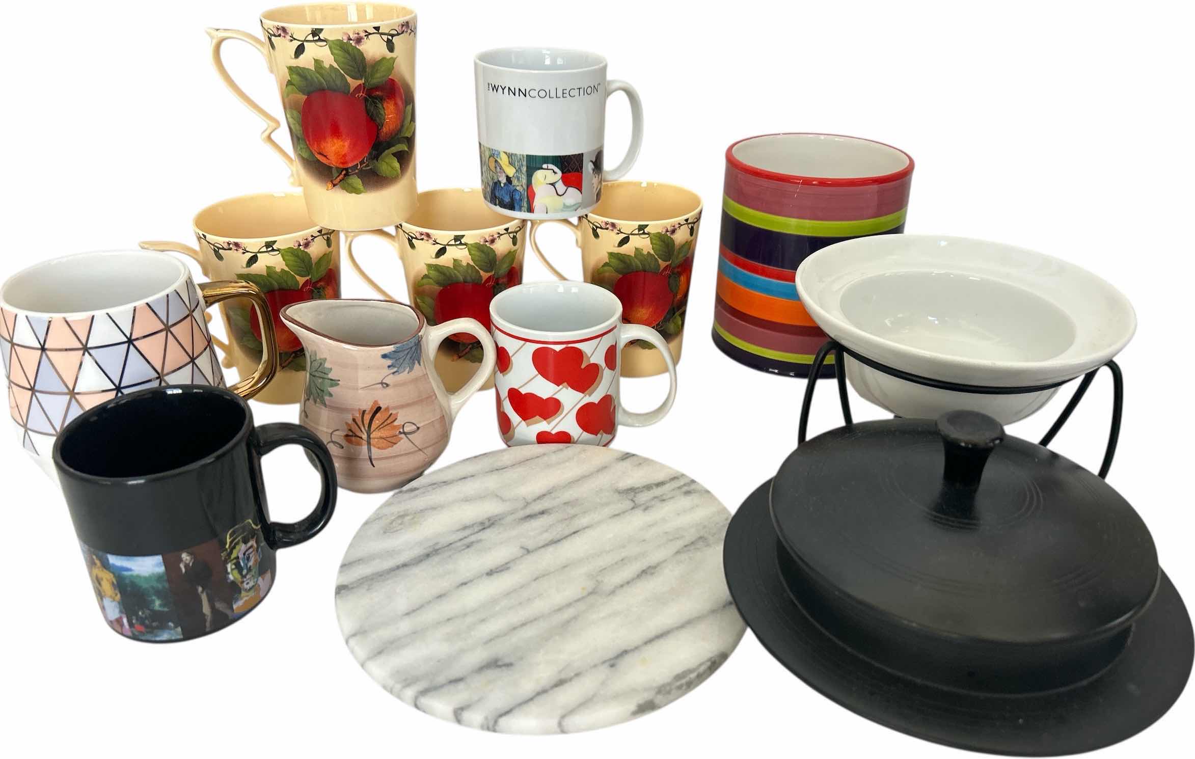 Photo 1 of KITCHEN / ENTERTAINMENT/ SERVING ITEMS- COFFEE MUGS , WINE HOLDER, TRIVIT AND MORE