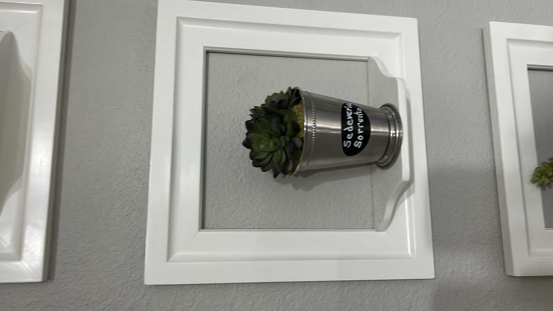 Photo 1 of WHITE WALL MOUNTED PLANTERS SET OF 3. 12” x 12”