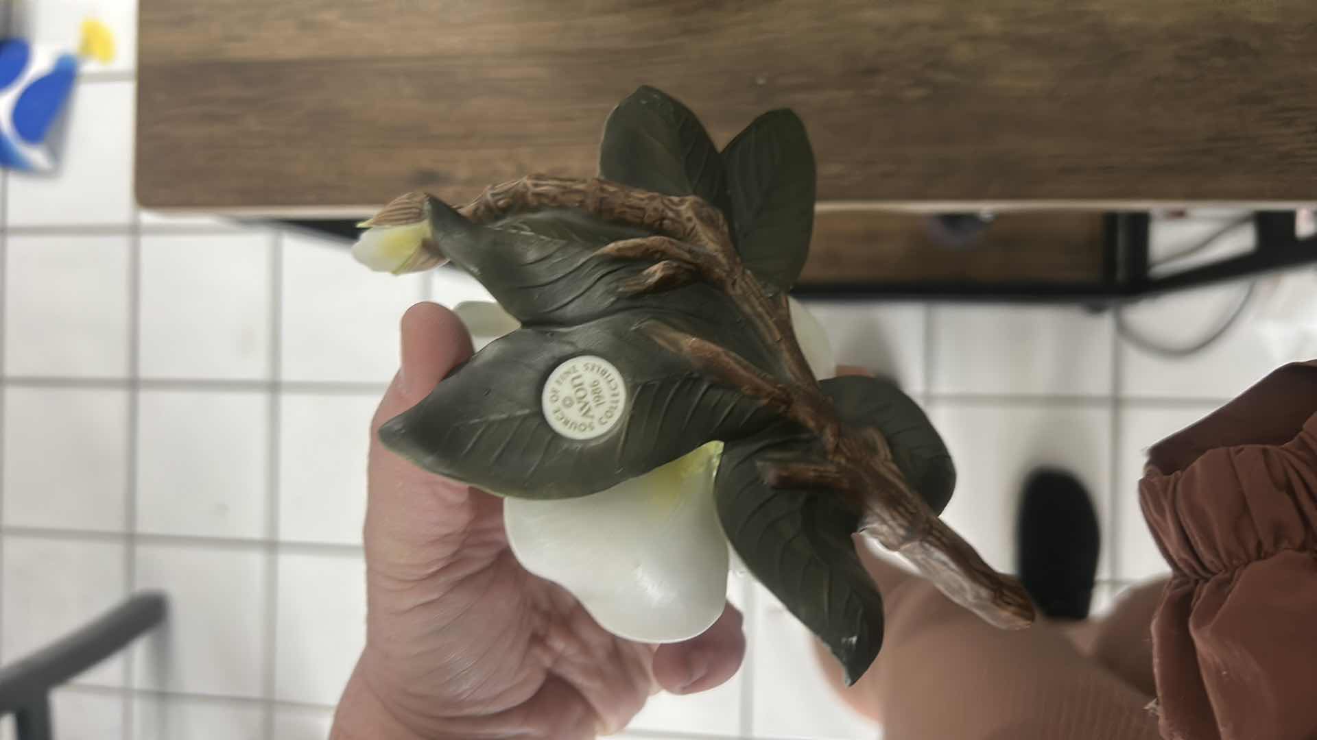 Photo 1 of GLASS AND METAL TERRARIUM H12” &  PORCELAIN MAGNOLIA FIGURINE.