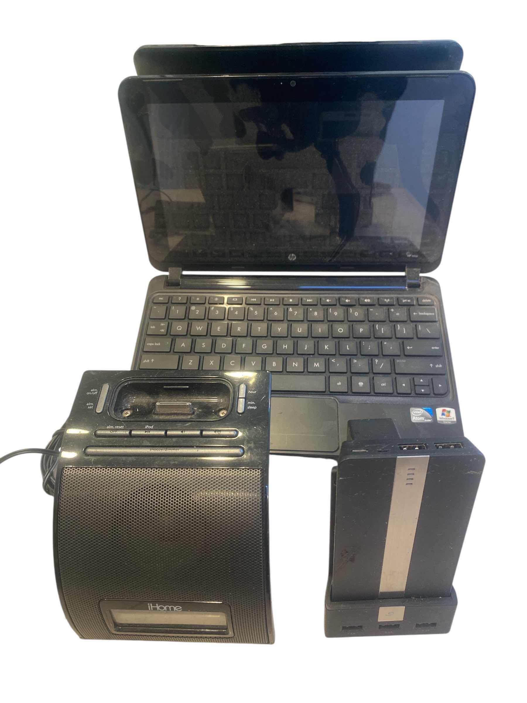 Photo 1 of ELECTRONICS - I HOME CHARGER WITH SPEAKER, BACK UP BATTERY & HP TABLET (some cords missing)