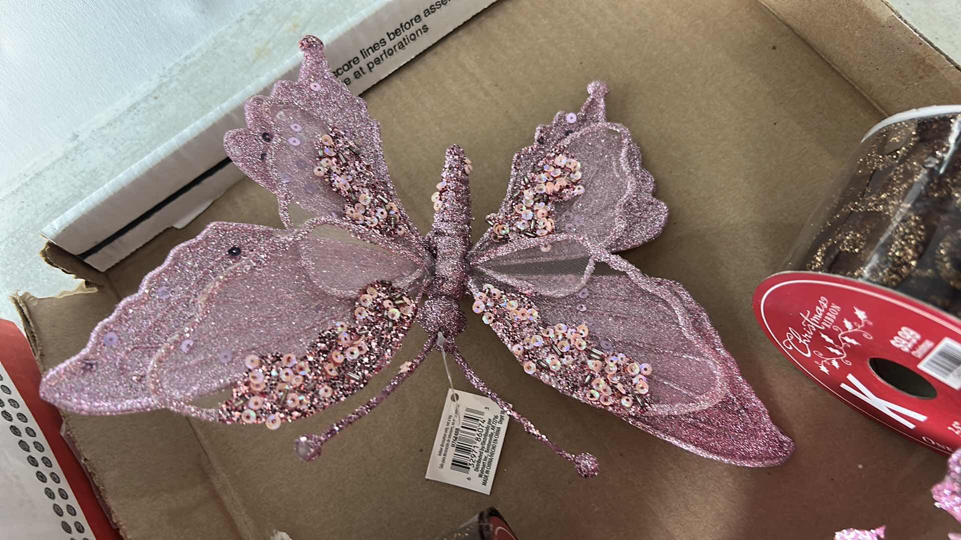Photo 1 of BOX FULL OF PINK POINSETTIAS, BUTTERFLIES, AND RIBBON