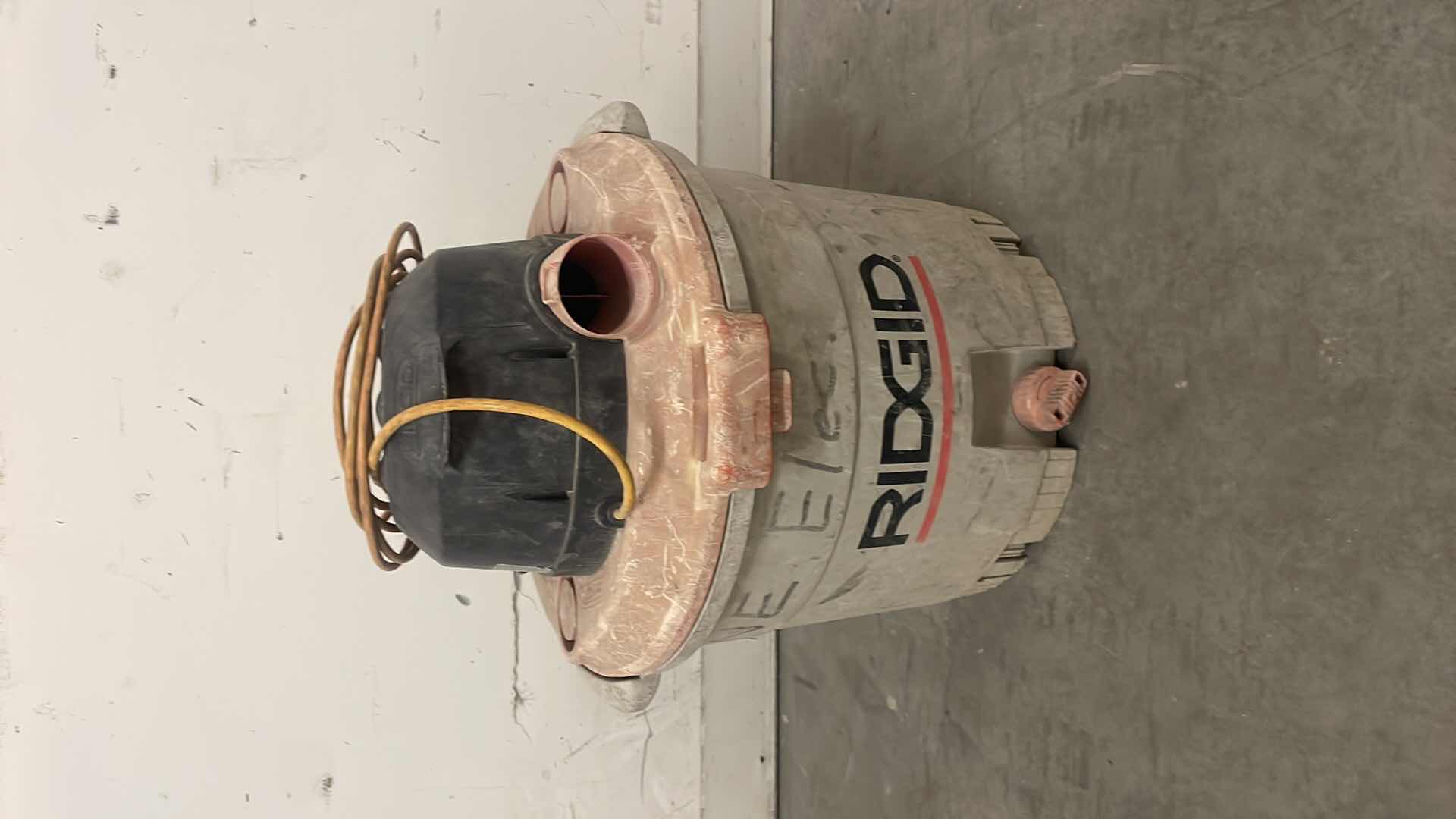 Photo 1 of RIDGID WETDRY VAC UNKNOWN 5 HP & 12 GALLON HOSE INSIDE