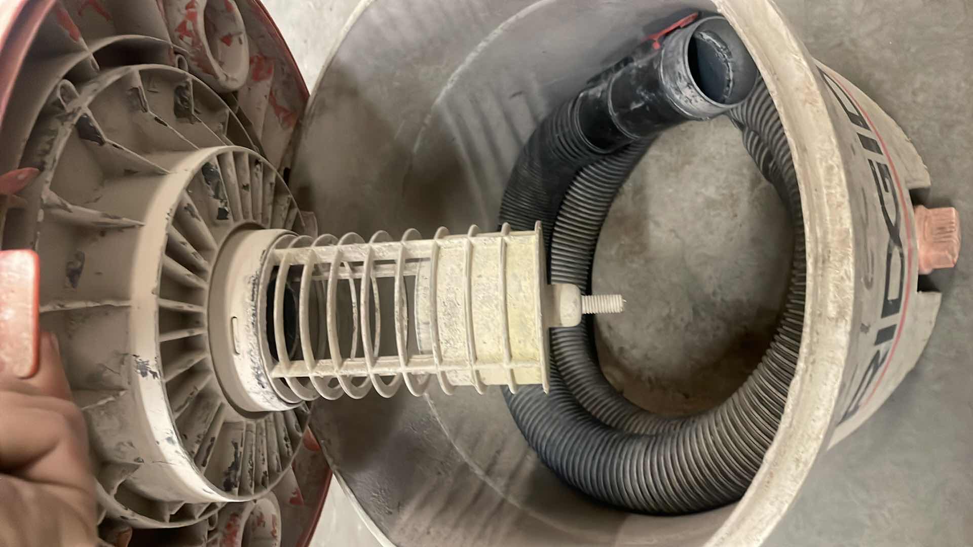 Photo 1 of RIDGID WETDRY VAC UNKNOWN 5 HP & 12 GALLON HOSE INSIDE