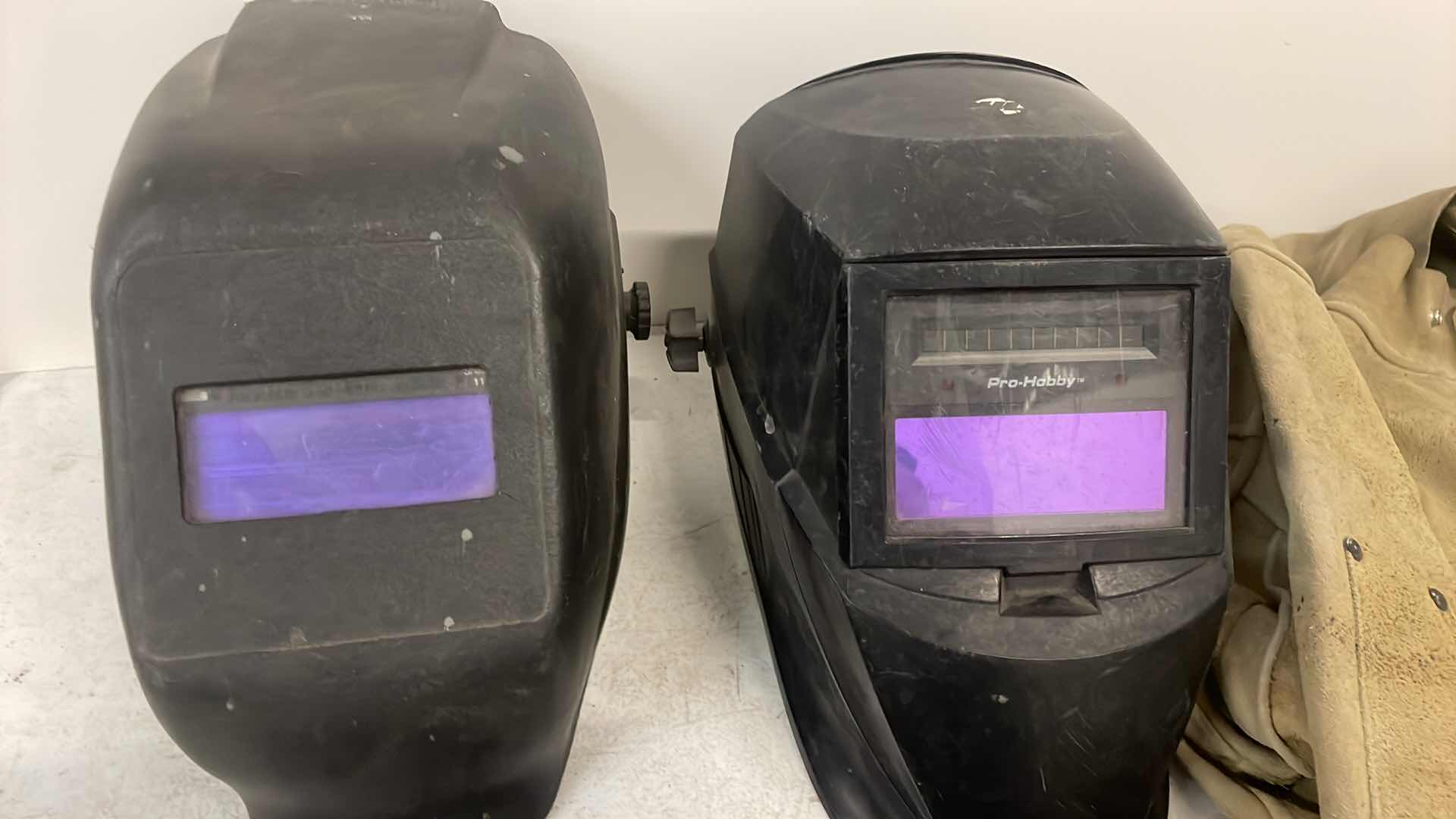 Photo 1 of WELDING HELMETS GLOVES AND RADNOR XL LEATHER JACKET