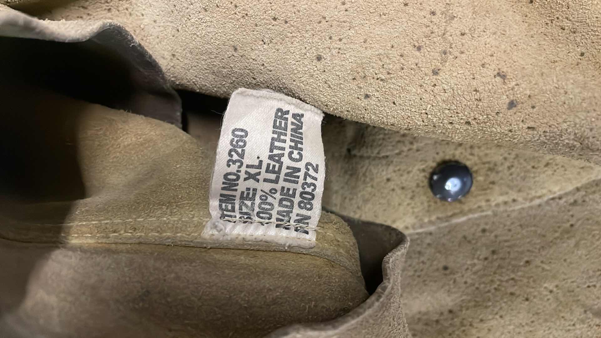 Photo 1 of WELDING HELMETS GLOVES AND RADNOR XL LEATHER JACKET