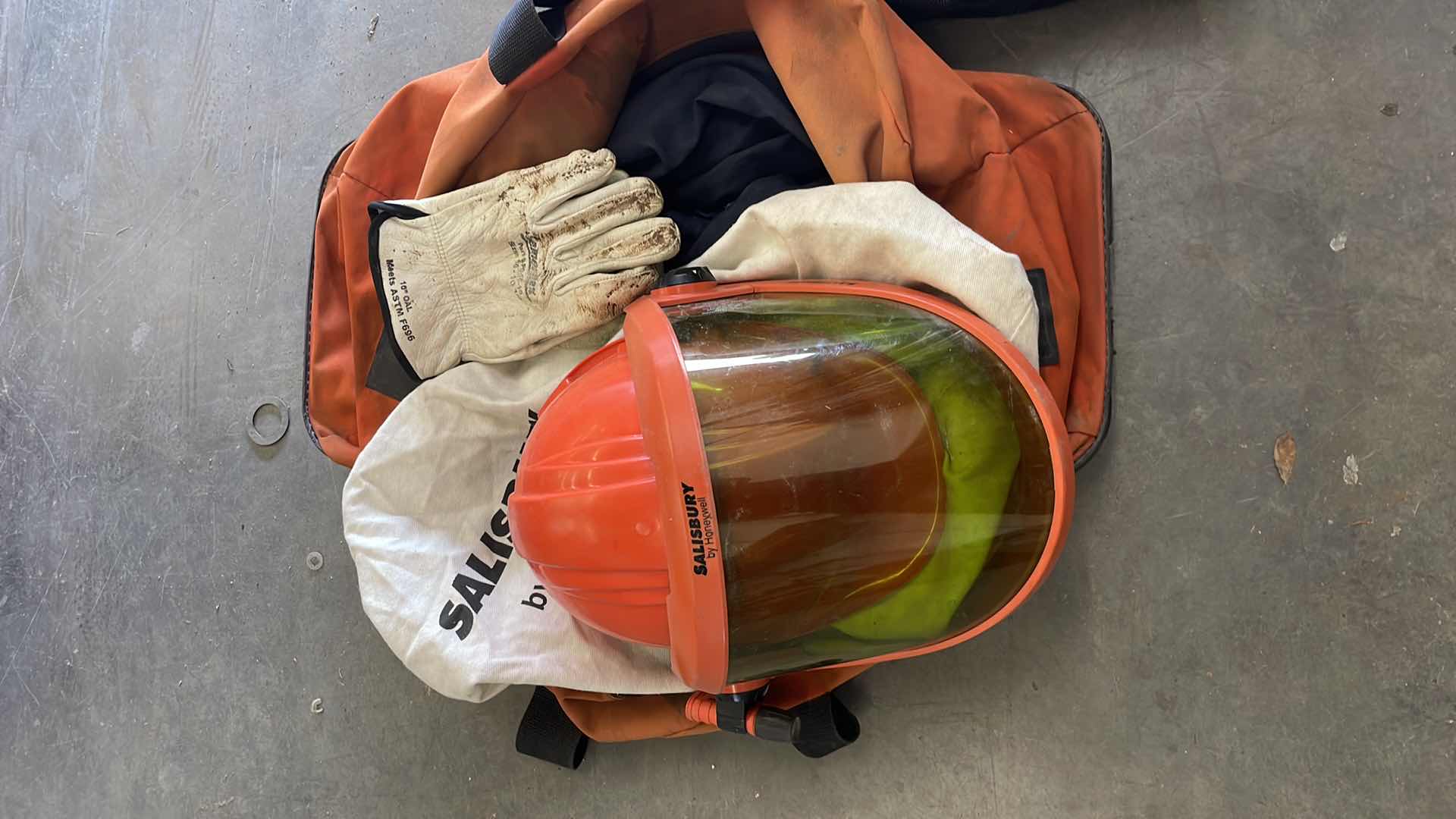 Photo 1 of ARC FLASH SHIELDS (3) GLOVES AND SALISBURY ARC FLASH JACKET SIZE LARGE BULWARK FR SIZE XL LONG SLEEVE SHORT