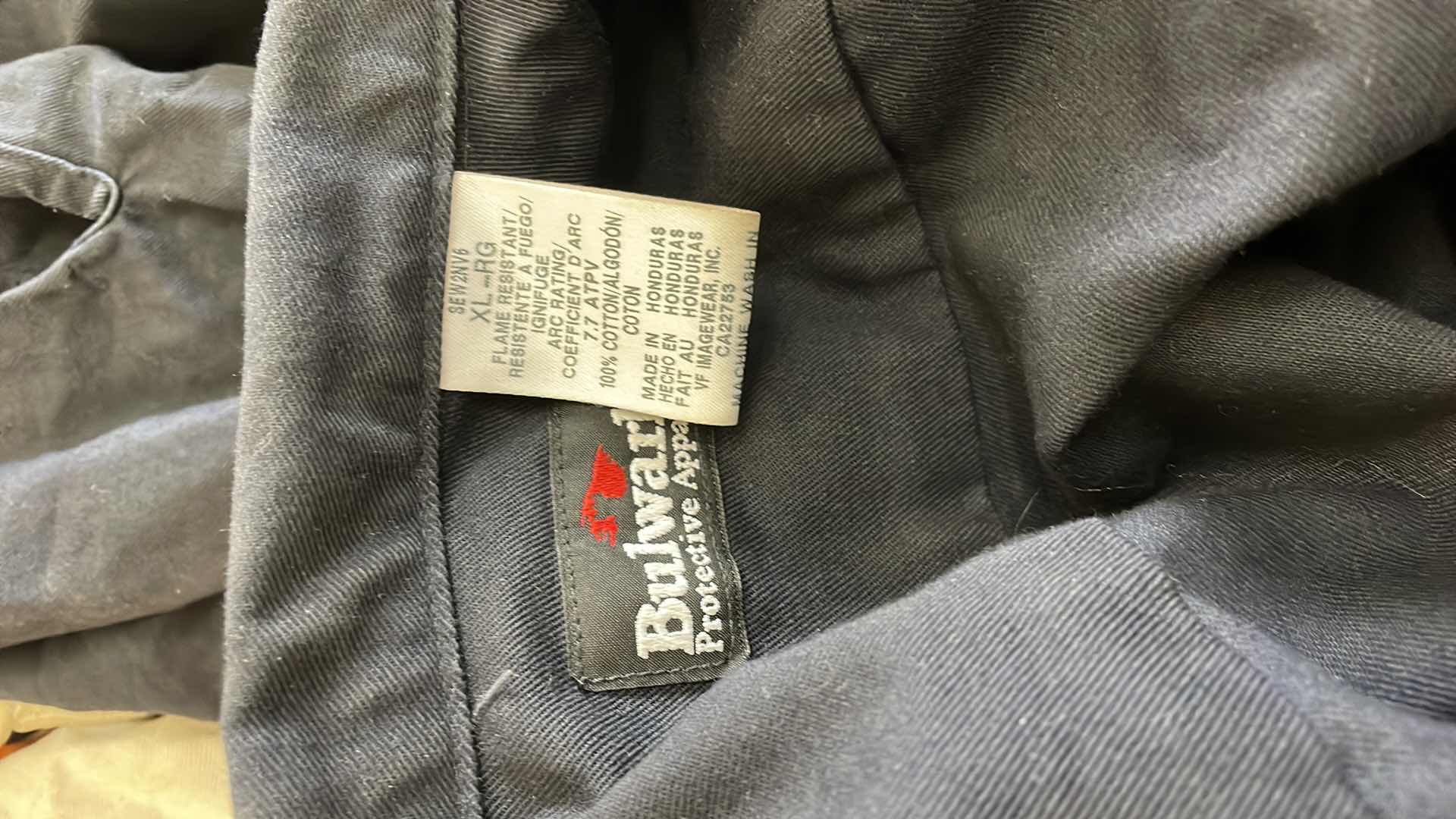 Photo 1 of ARC FLASH SHIELDS (3) GLOVES AND SALISBURY ARC FLASH JACKET SIZE LARGE BULWARK FR SIZE XL LONG SLEEVE SHORT