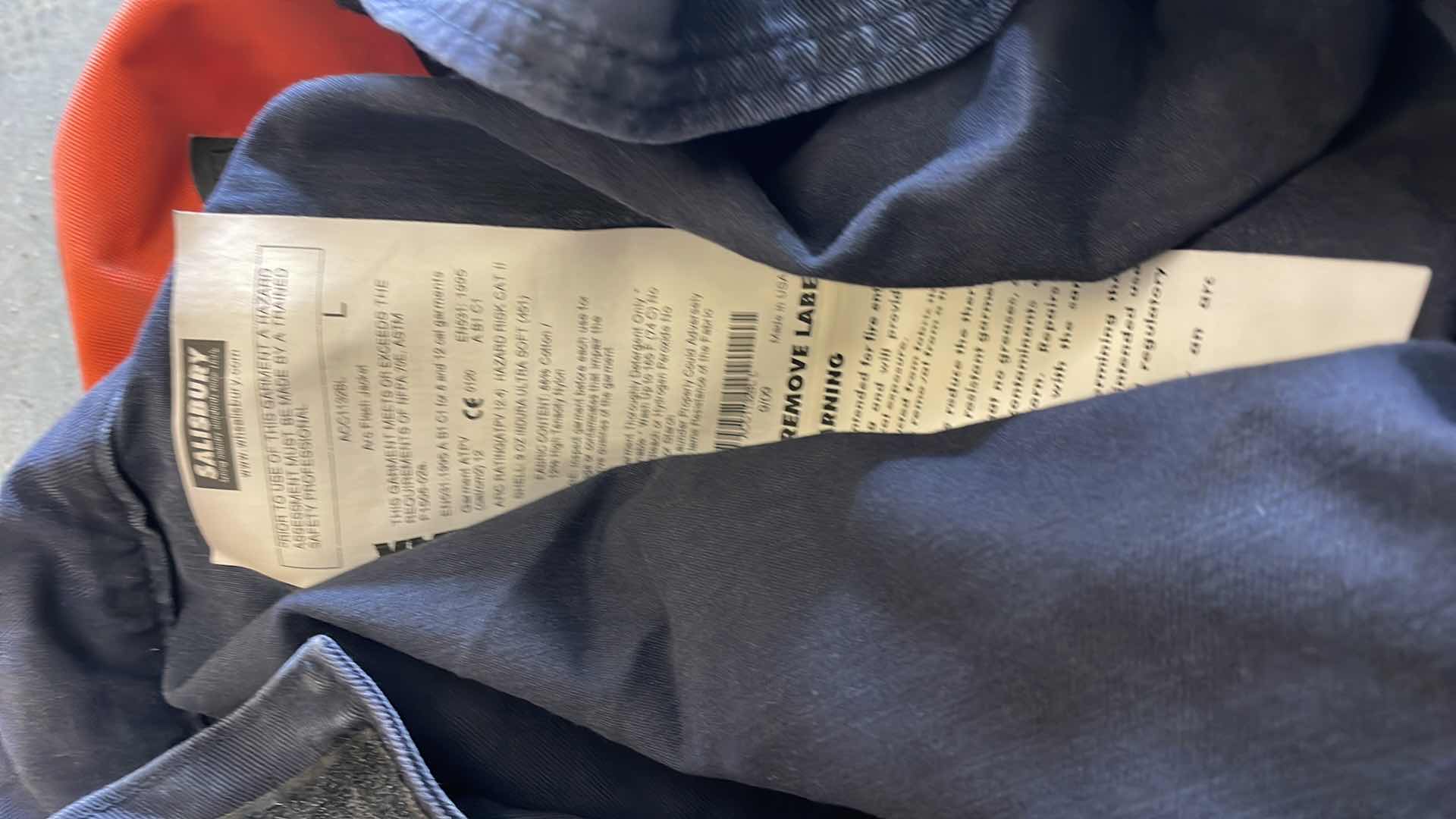 Photo 1 of ARC FLASH SHIELDS (3) GLOVES AND SALISBURY ARC FLASH JACKET SIZE LARGE BULWARK FR SIZE XL LONG SLEEVE SHORT