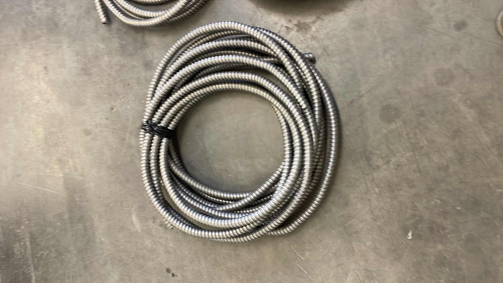 Photo 1 of FLEXIBLE ELECTRICAL CONDUIT VARIETY OF SIZES UNKNOWN FOOTAGE OR LENGTHS