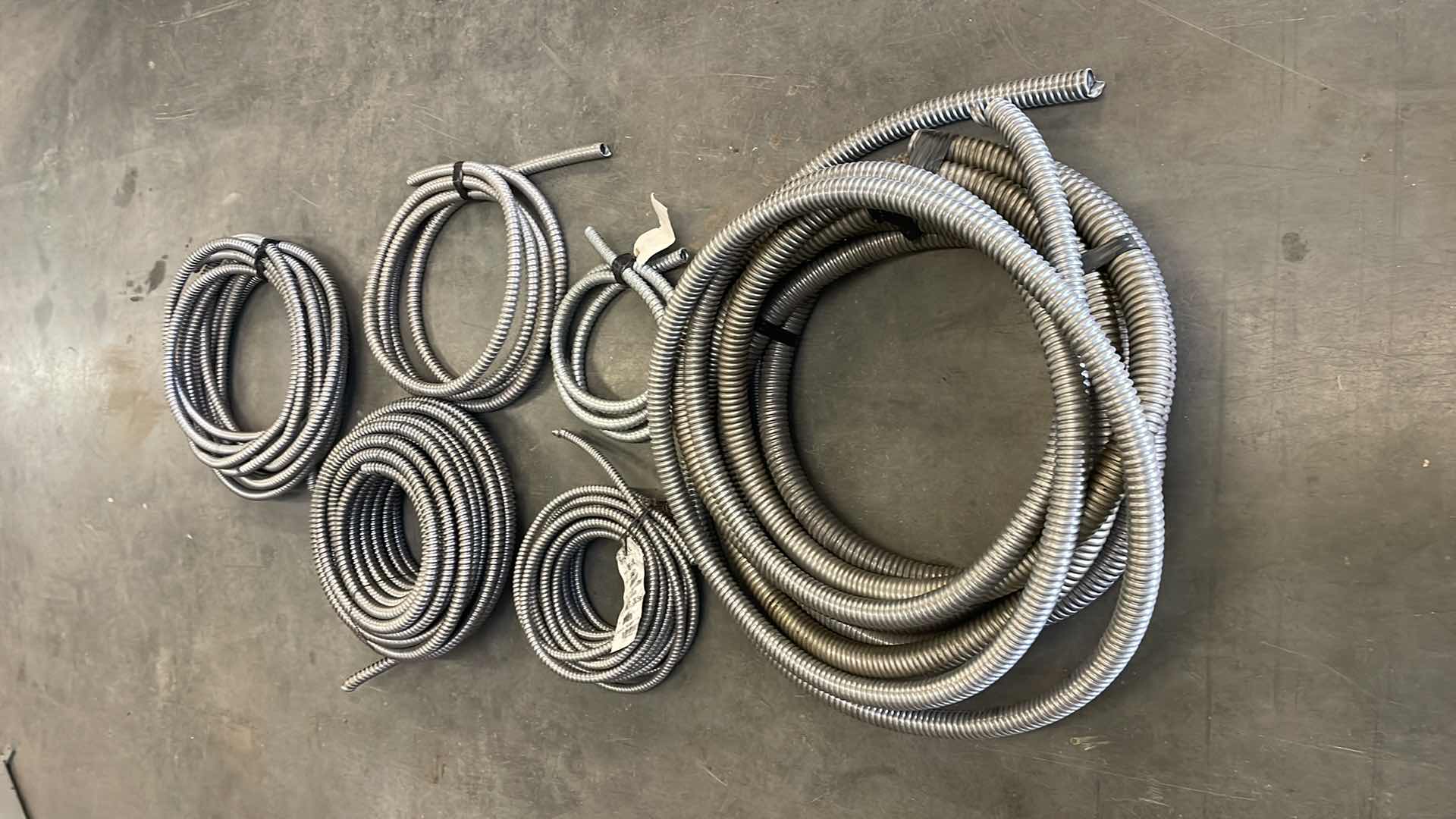 Photo 1 of FLEXIBLE ELECTRICAL CONDUIT VARIETY OF SIZES UNKNOWN FOOTAGE OR LENGTHS