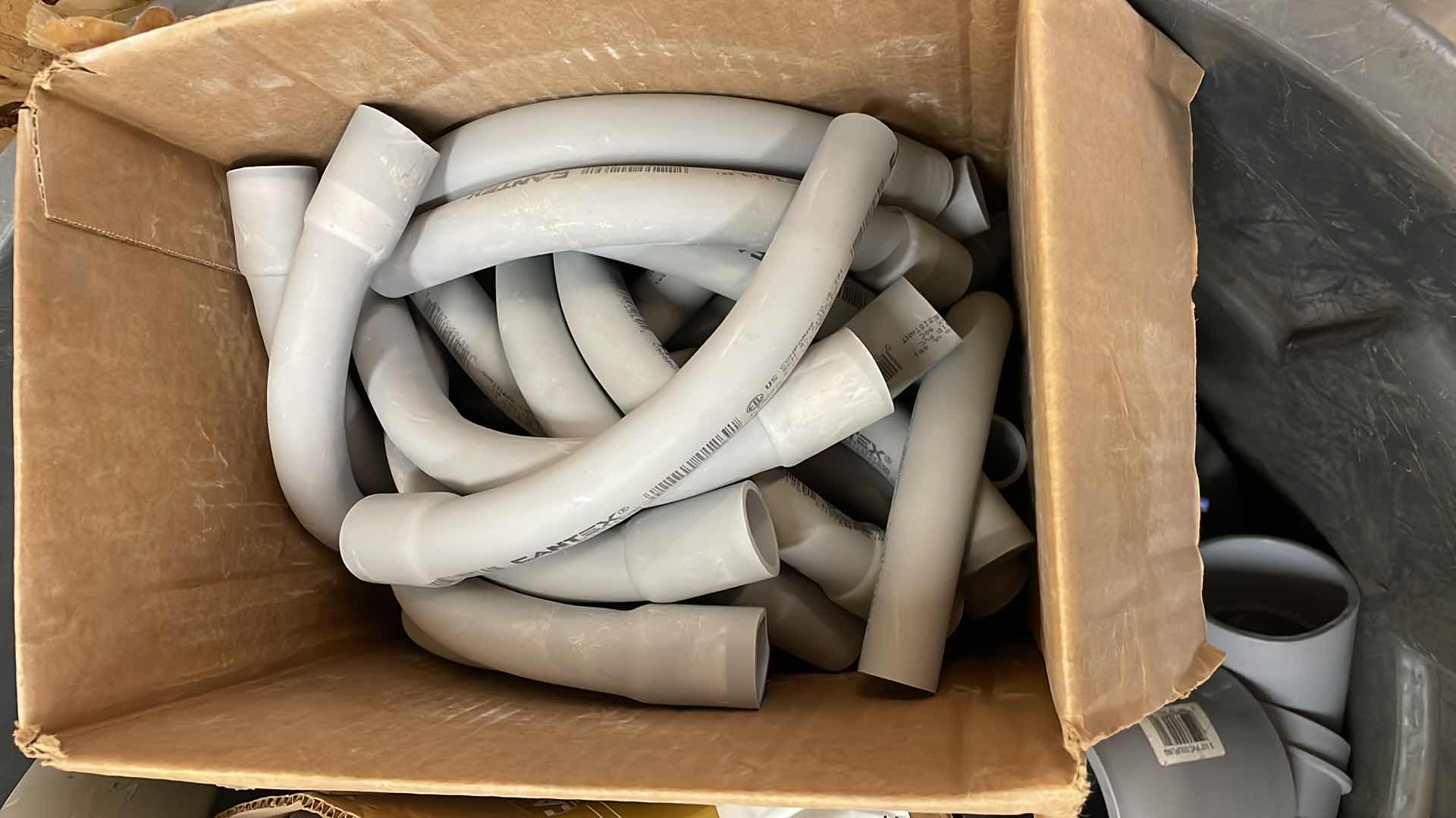 Photo 1 of BRUTE RUBBERMAID 55 GAL TRASH CAN FULL OF A VARIETY OF SCHEDULE 40 PVC 3/4”-3” ELBOWS, COUPLING, ADAPTERS,