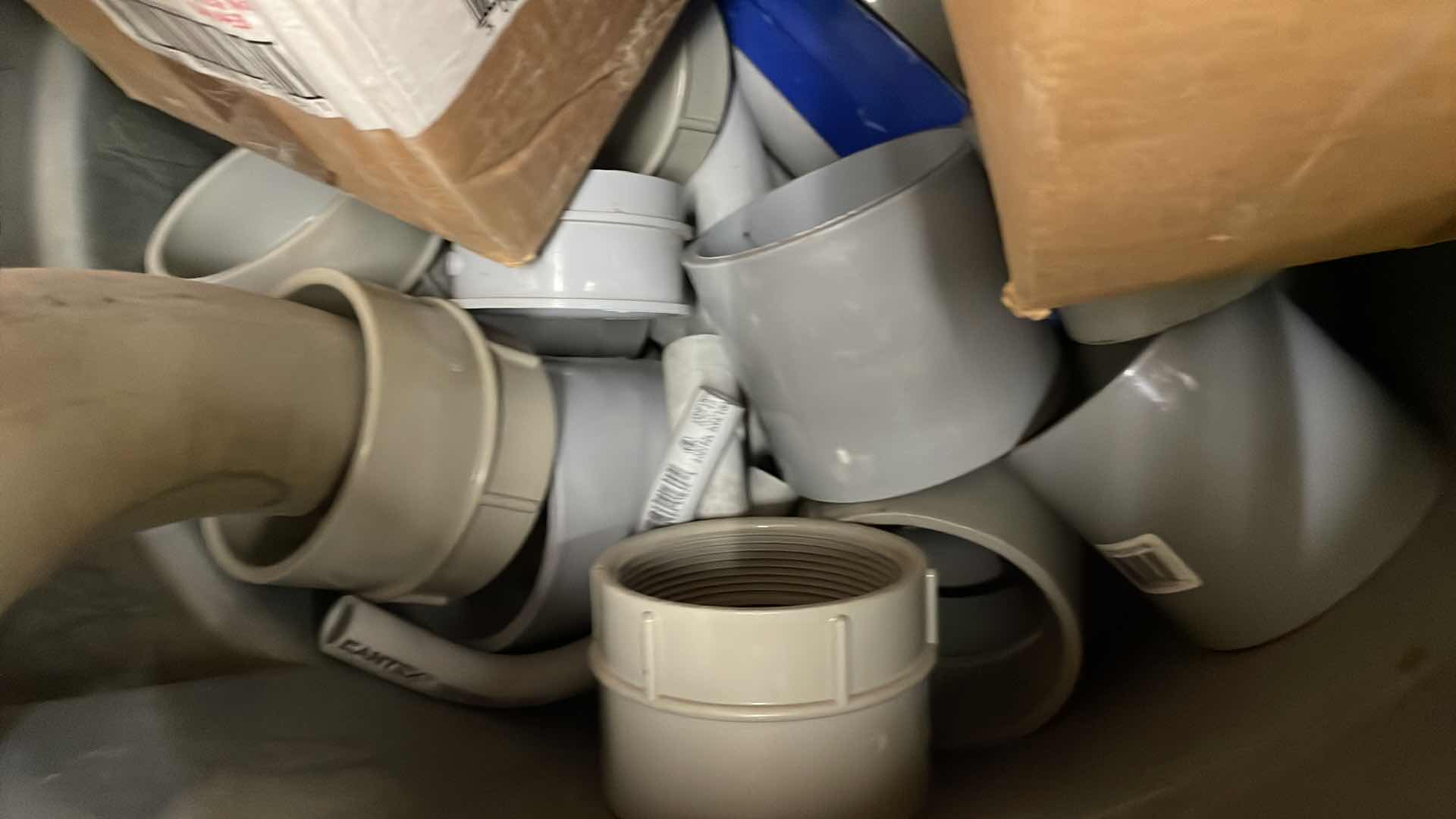 Photo 1 of BRUTE RUBBERMAID 55 GAL TRASH CAN FULL OF A VARIETY OF SCHEDULE 40 PVC 3/4”-3” ELBOWS, COUPLING, ADAPTERS,