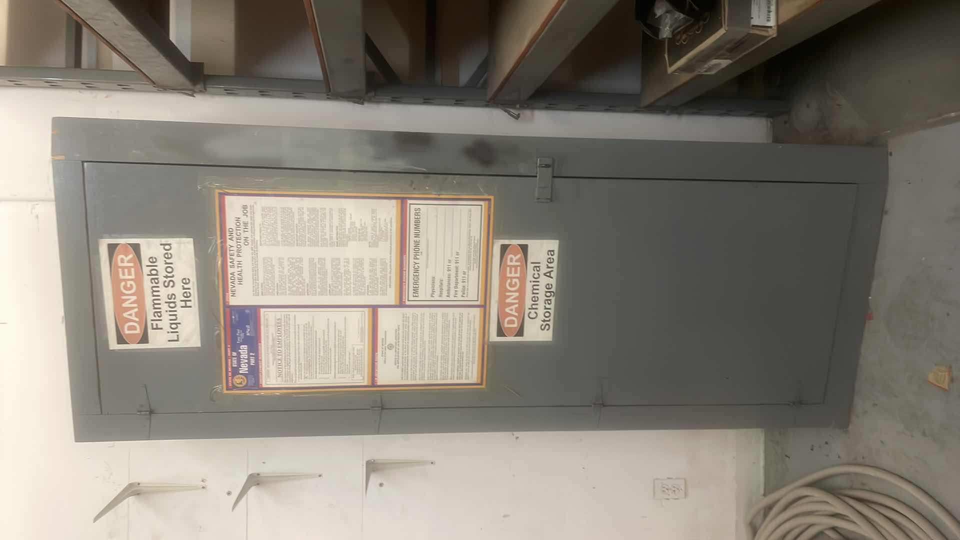 Photo 1 of ANGLED WOOD CABINET 13”-20” x 32” x 84 CONTENTS INCLUDED