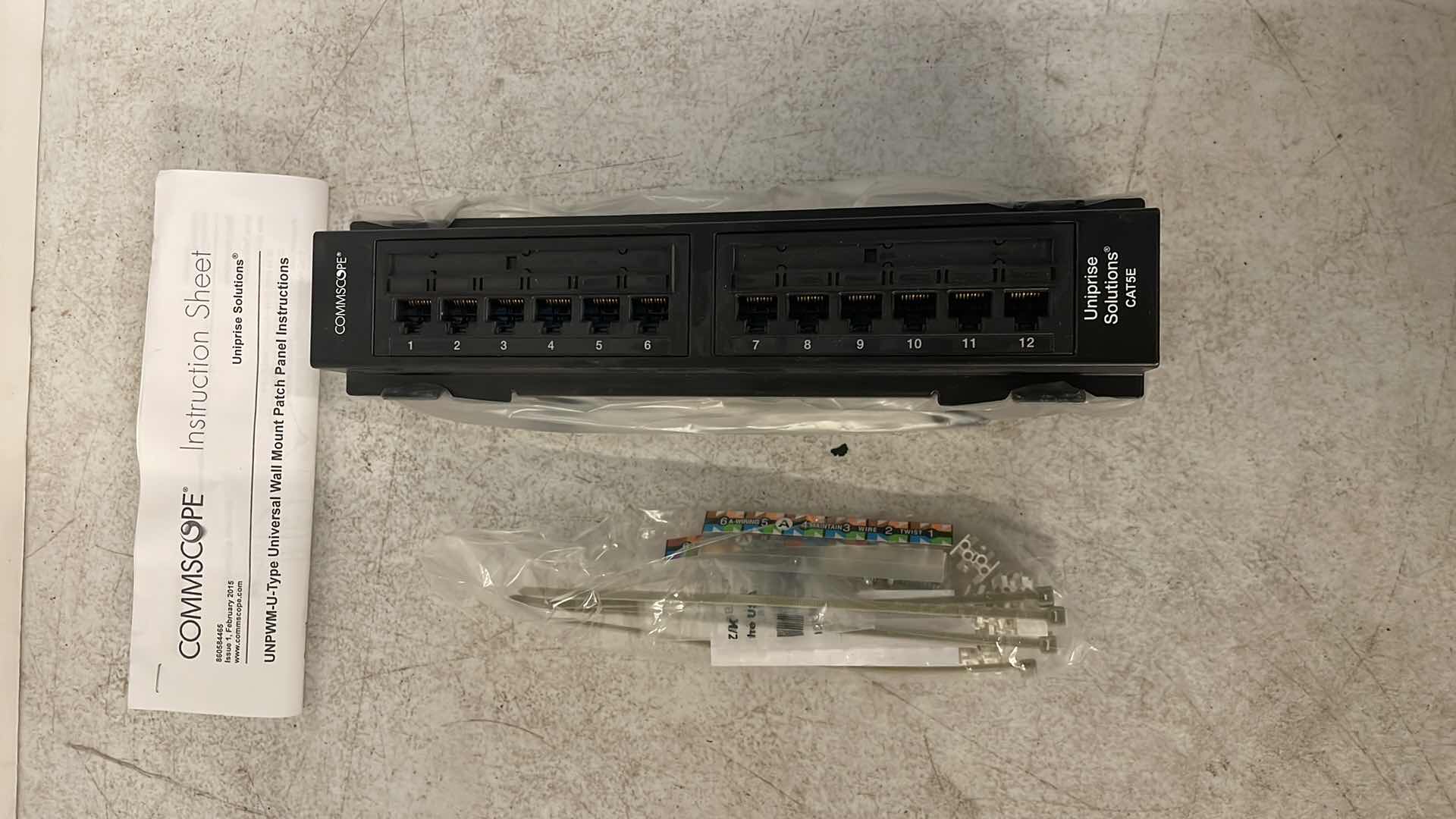 Photo 1 of COMMSCOPE UNIPRISE WALL MOUNT UNIVERSAL CAT5 PANEL 12 PORT