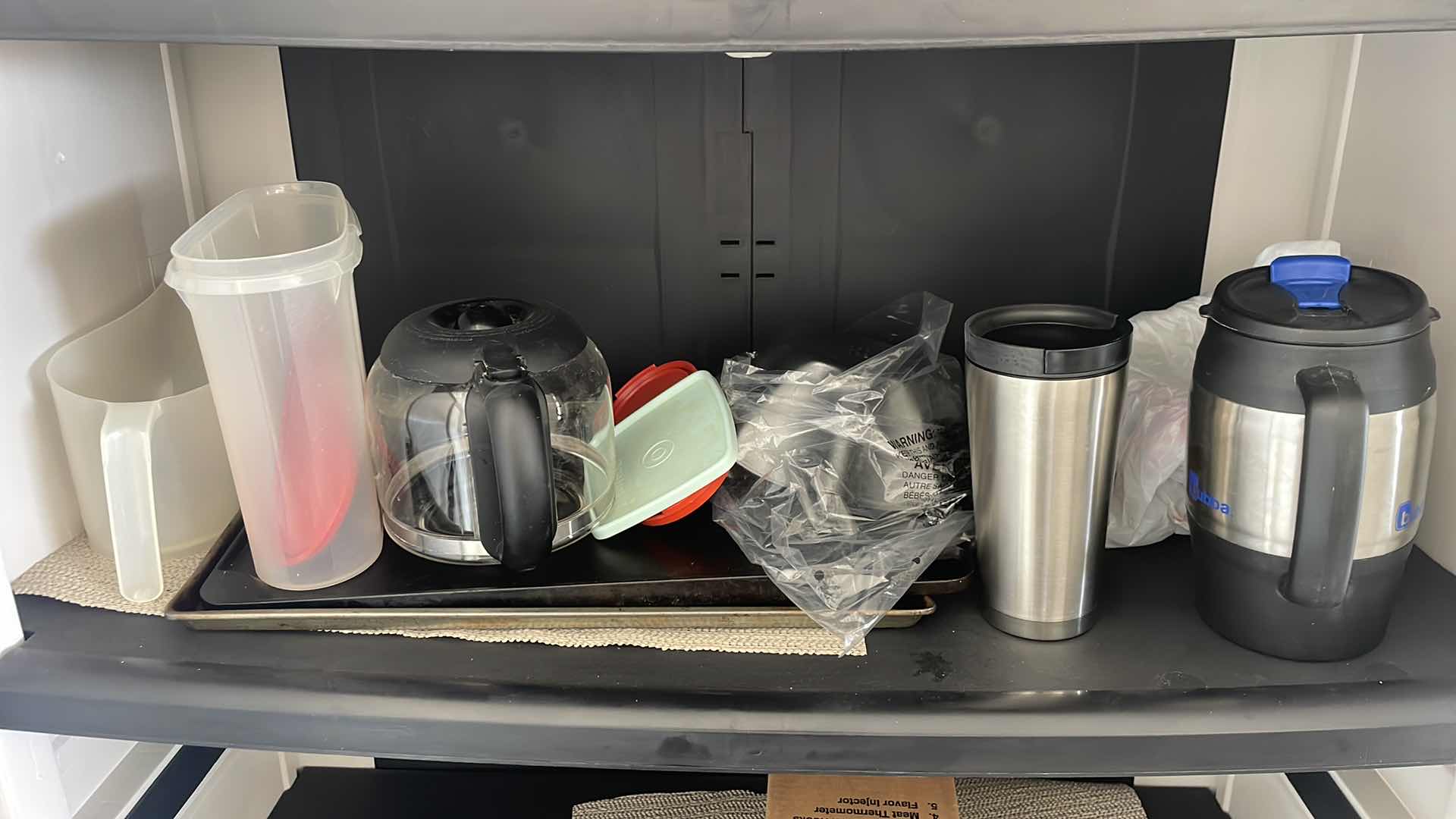 Photo 1 of PLASTIC STORAGE PANTRY 35”x18”x71” WITH CONTENTS