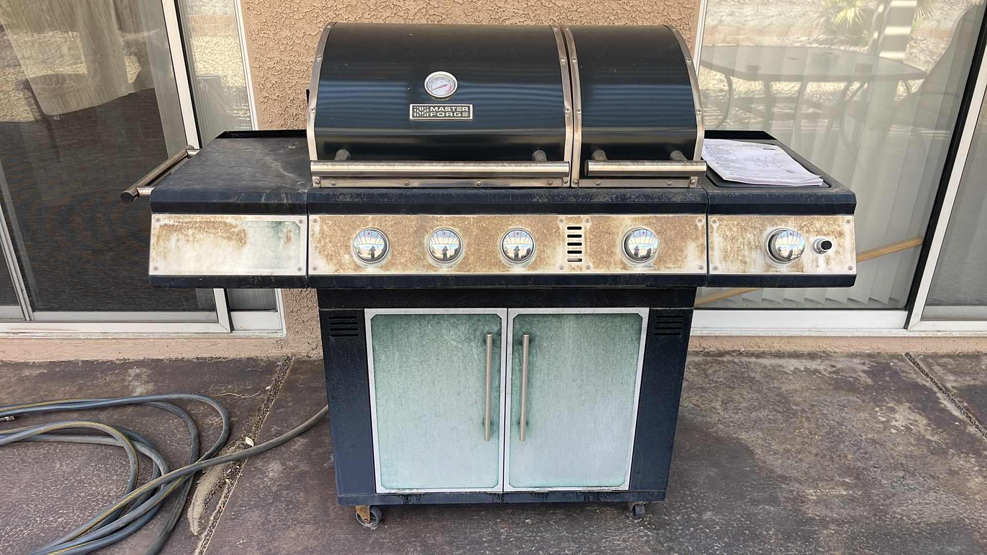 Photo 1 of MASTER FORGE 4-BURNER LIQUID PROPANE GAS GRILL