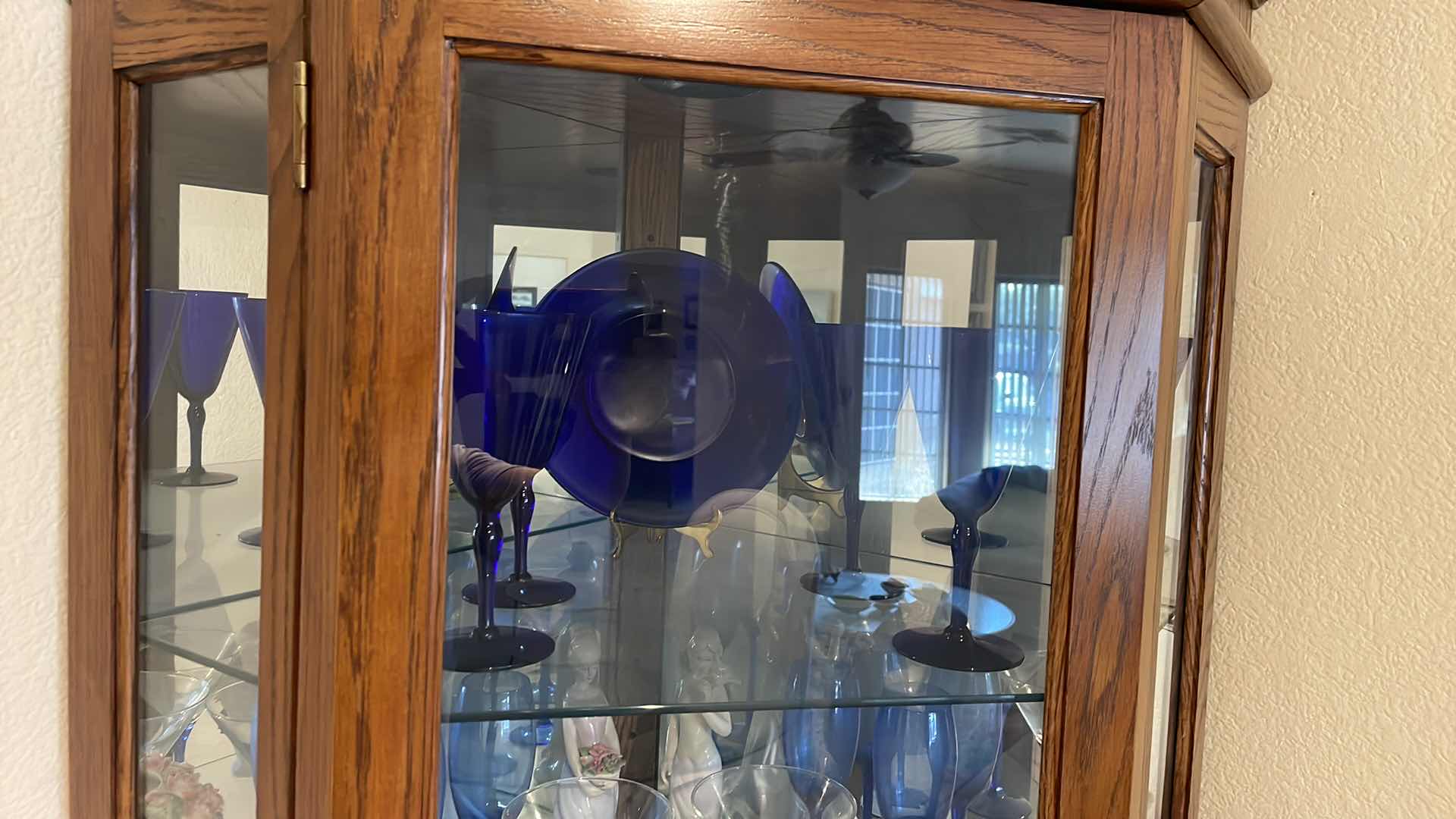 Photo 1 of LIGHTED OAK CORNER CURIO CABINET WITH CONTENTS