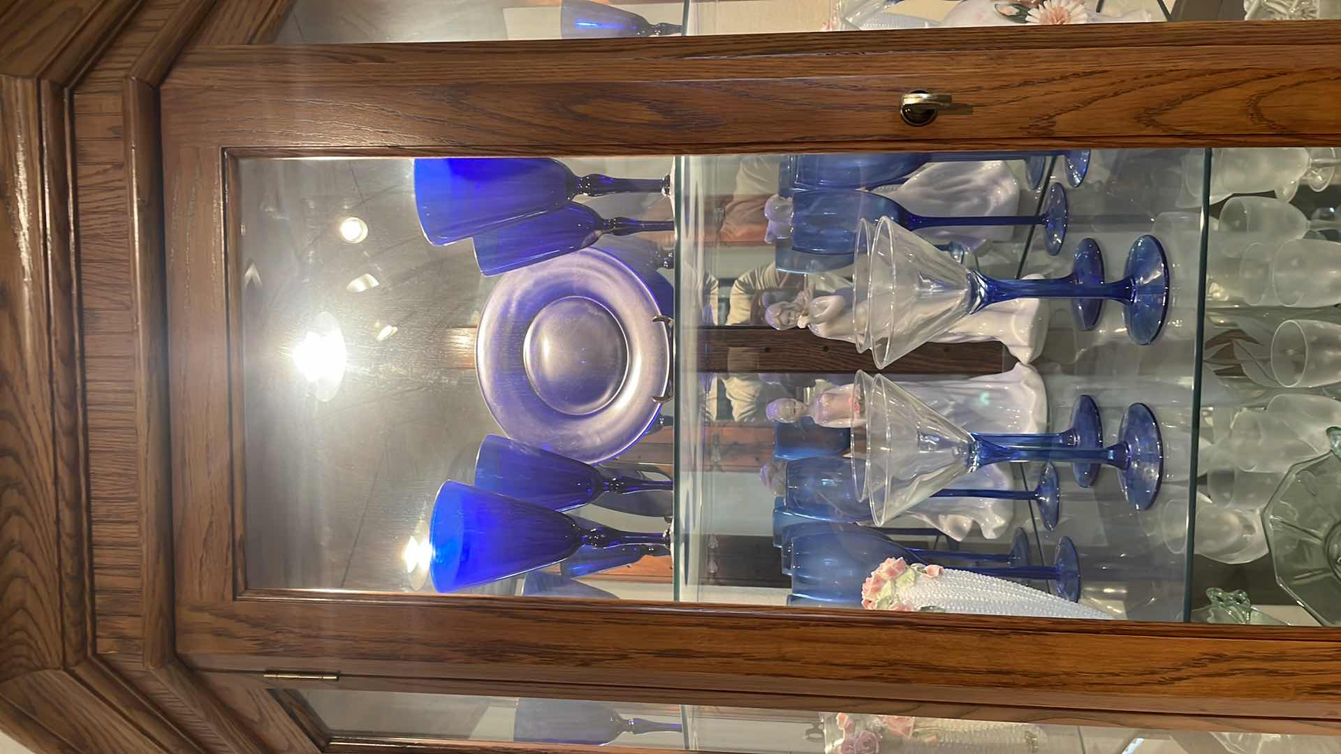 Photo 1 of LIGHTED OAK CORNER CURIO CABINET WITH CONTENTS