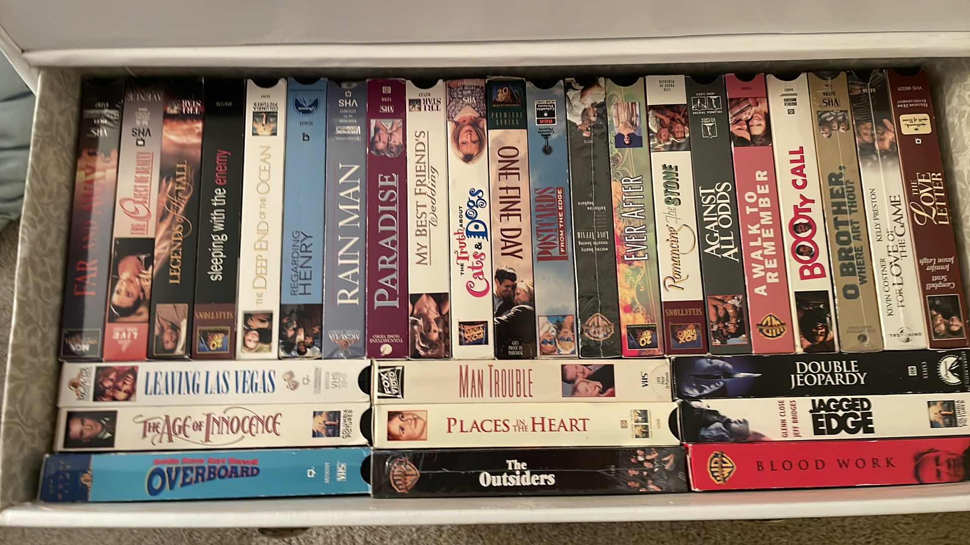 Photo 1 of CARDBOARD DRESSER FULL OF VHS SEE PICTURES 24”x12”x28”