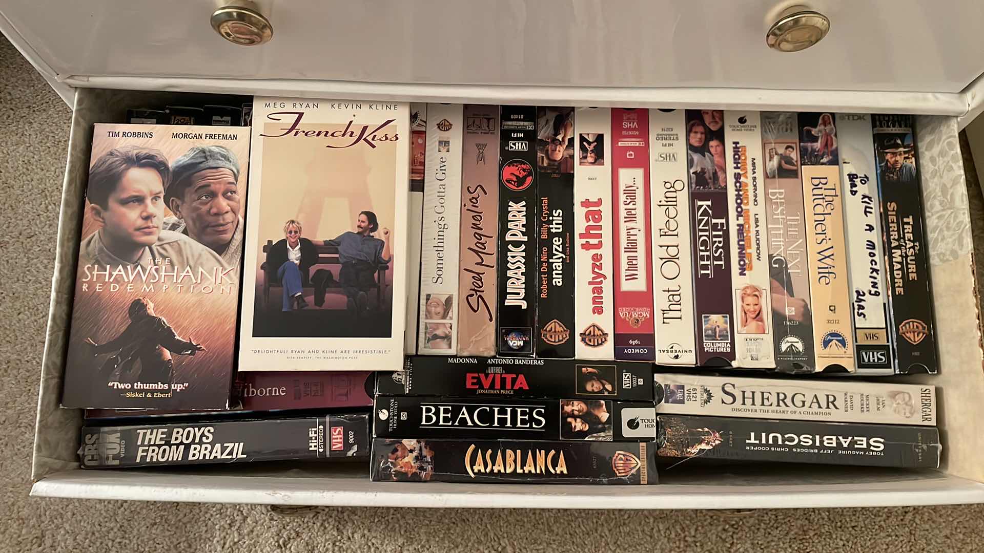 Photo 1 of CARDBOARD DRESSER FULL OF VHS SEE PICTURES 24”x12”x28”