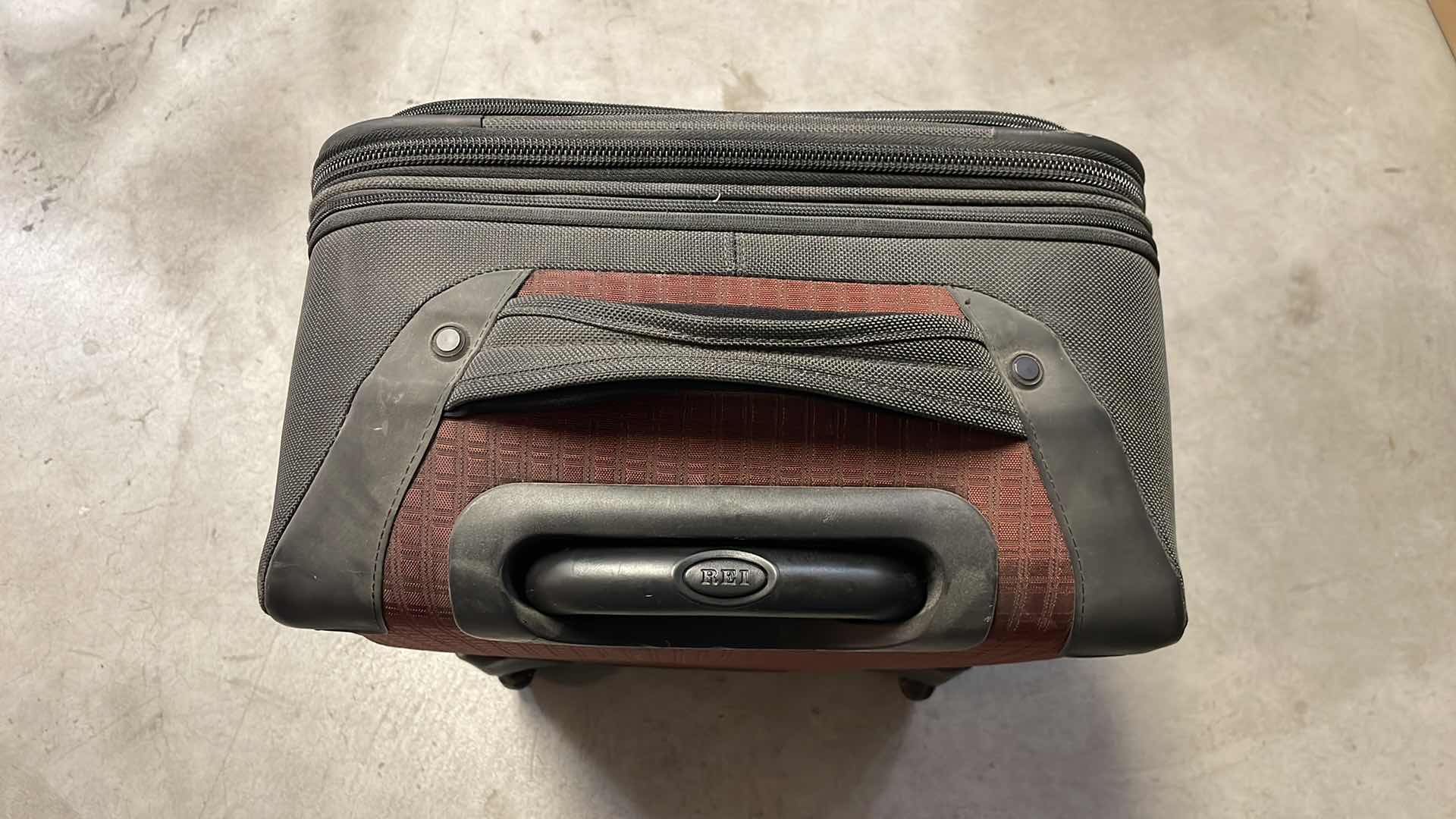 Photo 1 of REI CARRY ON SUIT CASE WITH 2 SMALLER MATCHING BAGS.