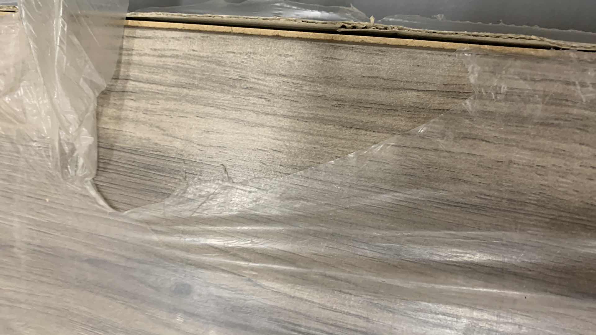 Photo 1 of 9-PIECES OF LAMINATE FLOORING WITH GREENGUARD 24.7” SQ. FT LAKESHORE P BRONZE