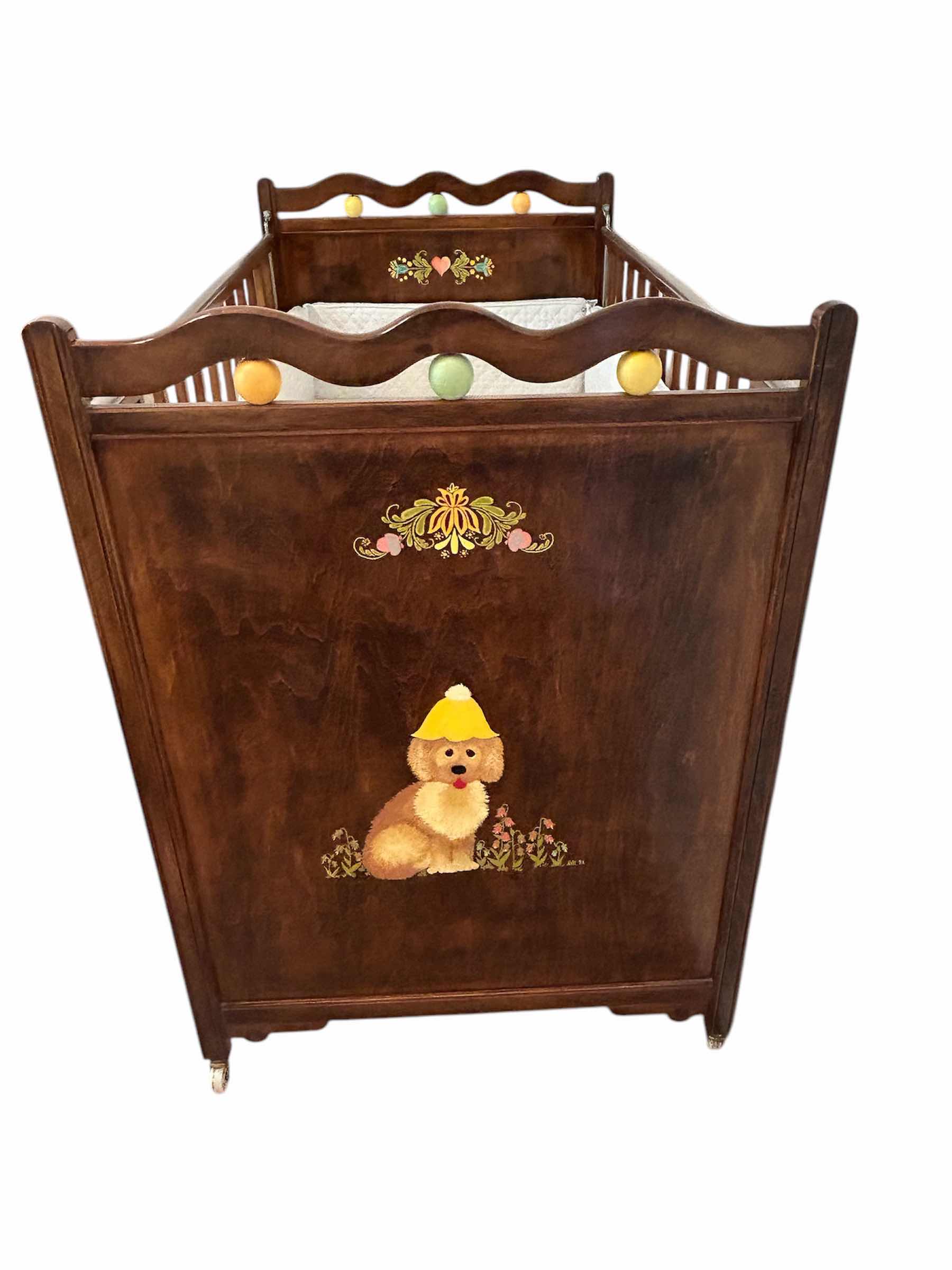 Photo 2 of VINTAGE WOODEN BABY CRIB MID 20th CENTURY FEATURING A DROP SIDE MECHANISM 54” X 30” H 44”