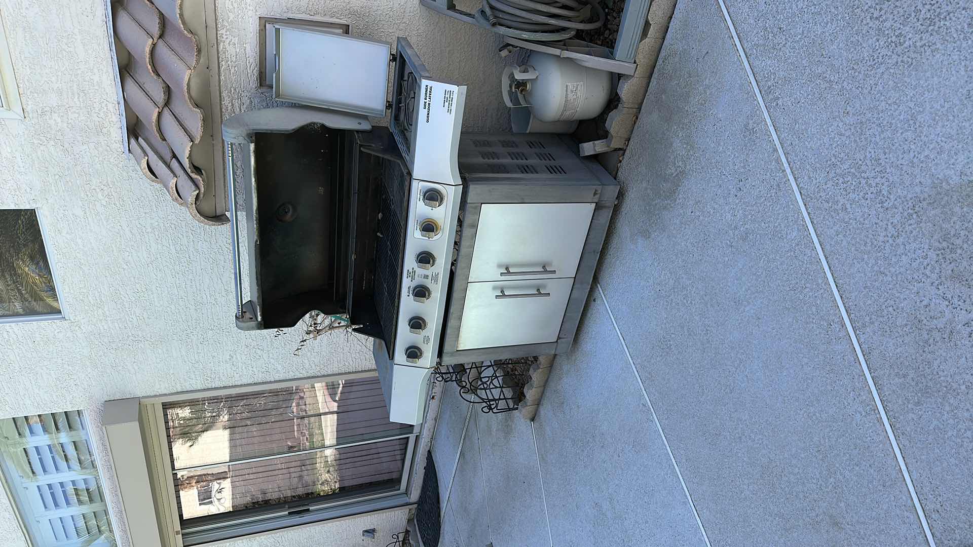 Photo 1 of BRINKMANN OUTDOOR PROPANE BBQ USED NEEDS TLC TWO PROPANE TANKS