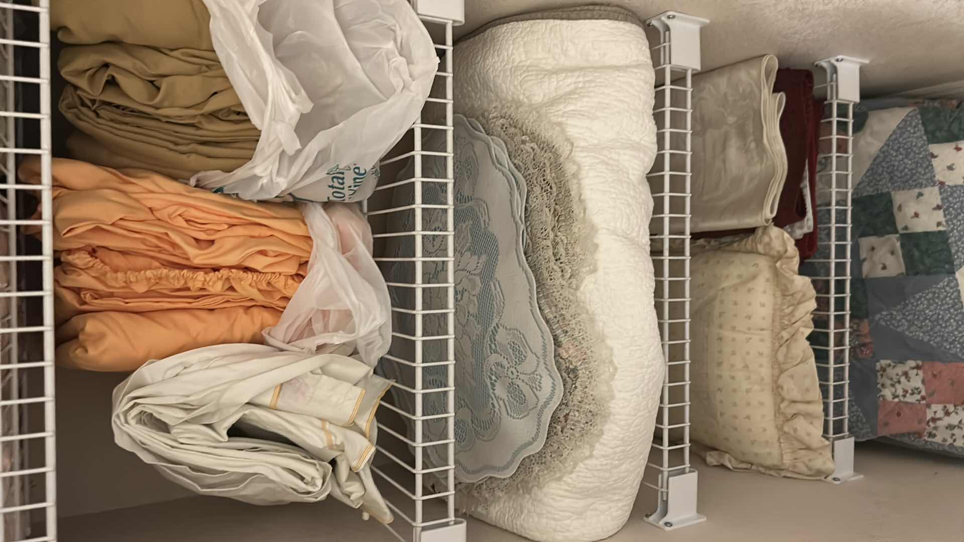 Photo 3 of CONTENTS OF CLOSET ASSORTED SHEETS QUILTS PLACEMATS