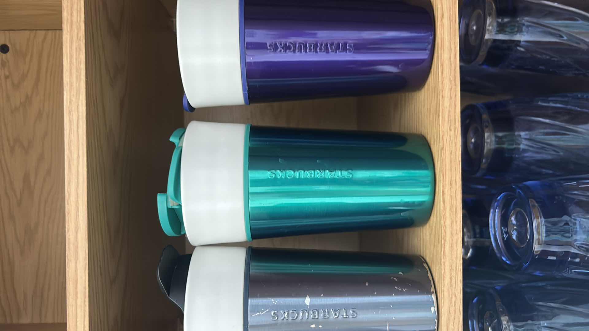 Photo 1 of CONTENTS OF SHELF 8 BLUE PLASTIC TUMBLERS 3 STARBUCKS COFFEE