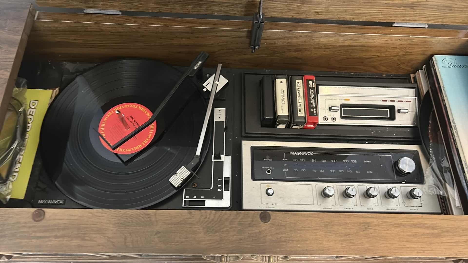 Photo 1 of VINTAGE MAGNAVOX RECORD PLAYER CABINET  WITH MAGNAVOX RADIO, 8 TRACK PLAYER,  ALBUMS &  MORE 6“ x 16“ x H27“