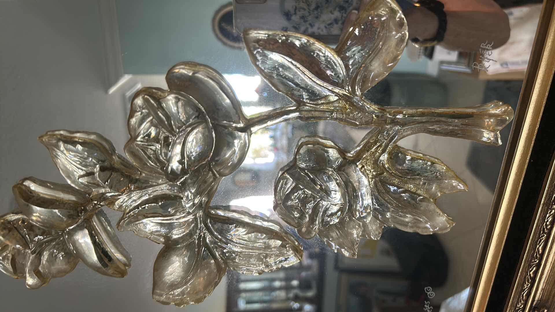 Photo 1 of DECORATIVE MIRROR W AN ORNATE GOLD COLORED FRAME AND RAISED METALLIC FLORAL 17" X 20"