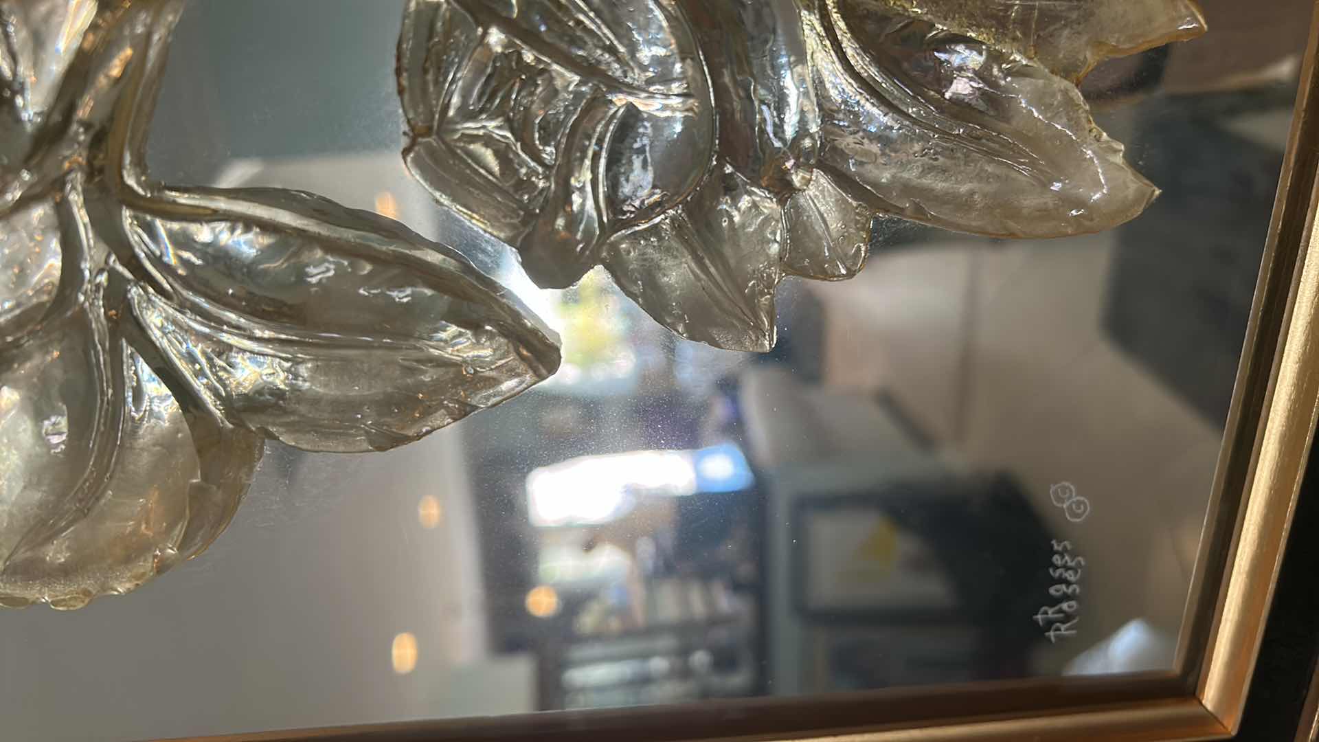 Photo 1 of DECORATIVE MIRROR W AN ORNATE GOLD COLORED FRAME AND RAISED METALLIC FLORAL 17" X 20"