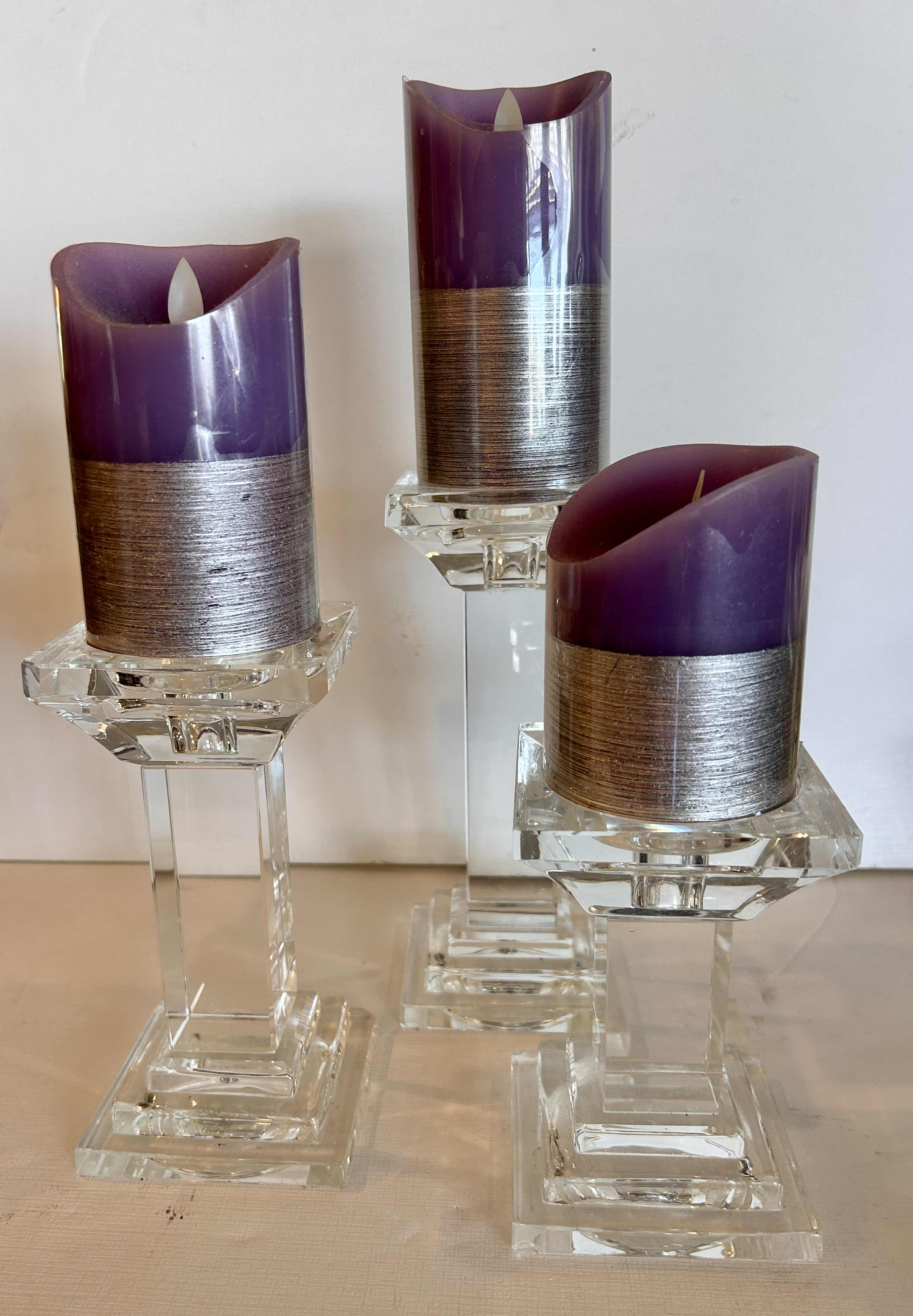 Photo 1 of 3 CANDLE HOLDERS  ( TALLEST H 8.75”) AND 3 BATTERY OPERATED CANDLES