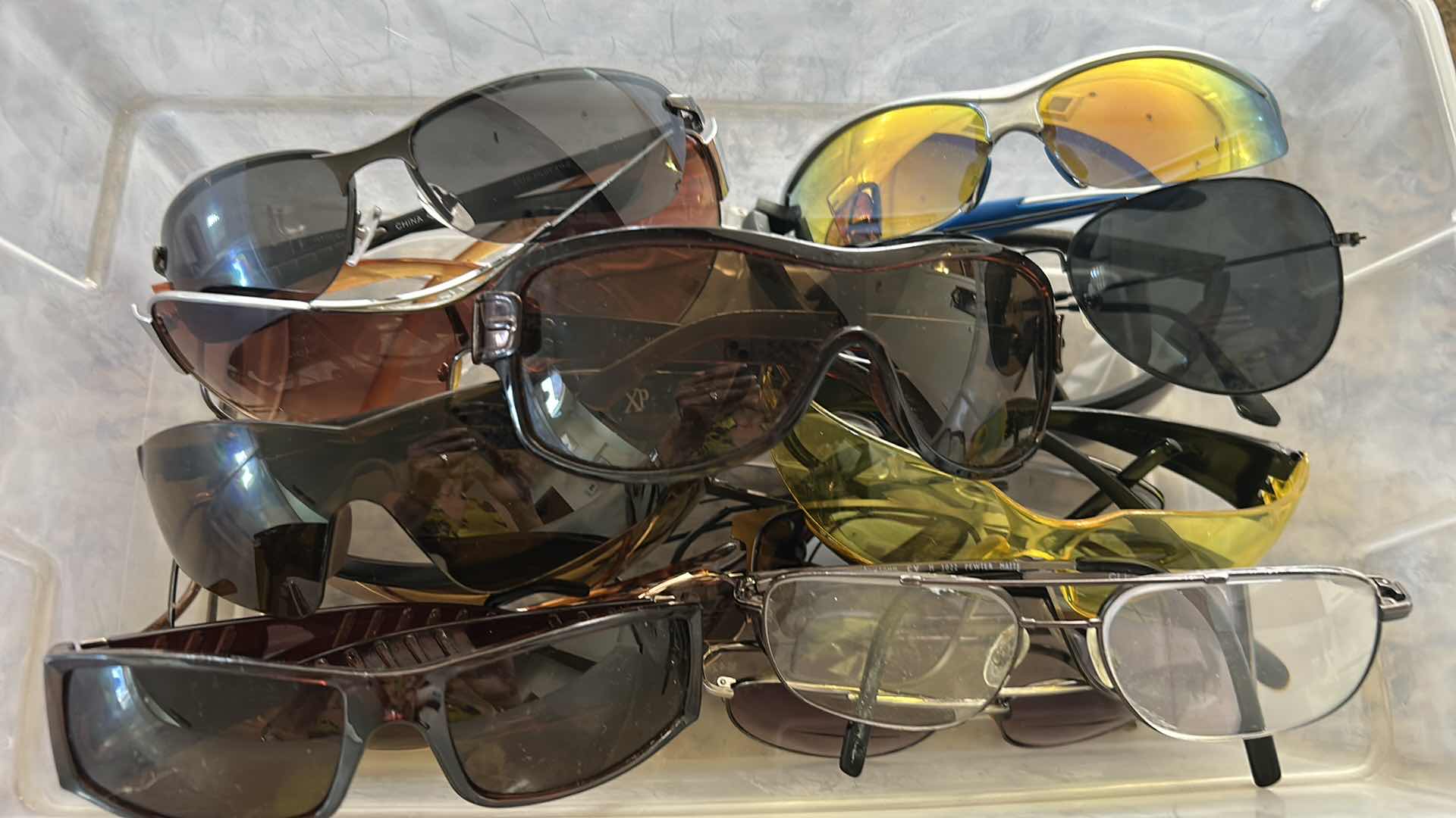 Photo 1 of CONTENTS OF CONTAINER ASSORTED SUN GLASSES AND EYEWEAR