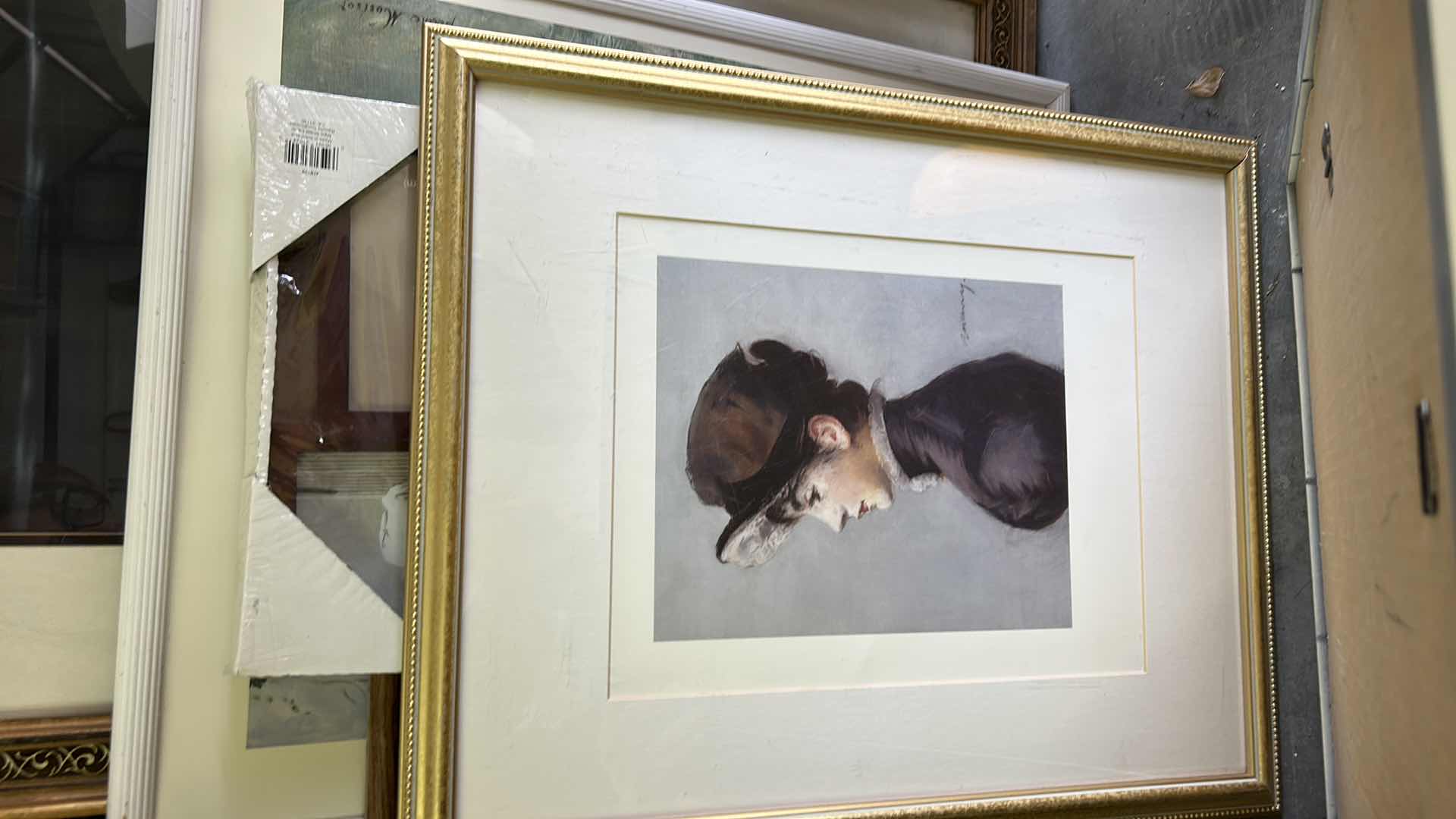 Photo 1 of STACK OF ARTWORK AND FRAMES ( LARGEST 27 x H37.5”)