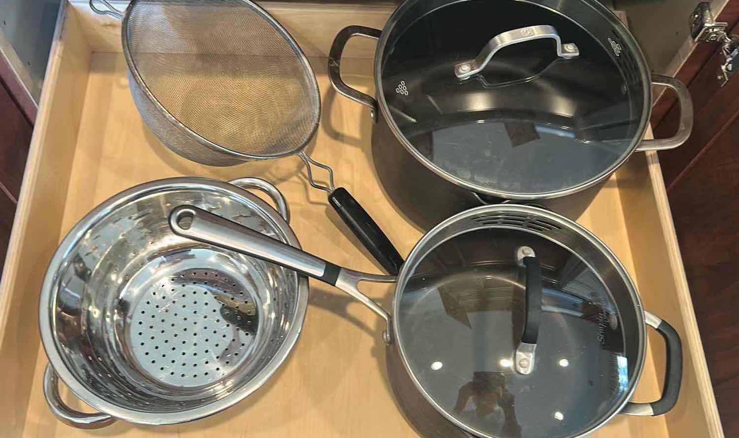 Photo 1 of CONTENTS OF CABINET POTS AND PANS