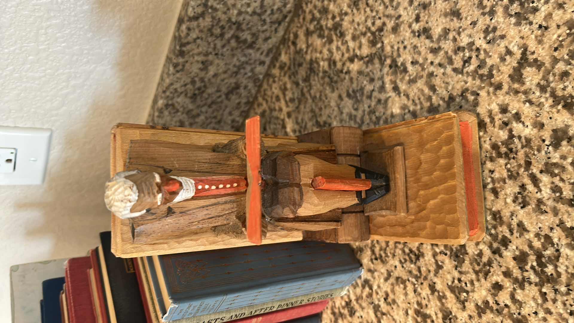 Photo 1 of TWO CARVED WOODEN BOOKENDS W 14 BOOKS