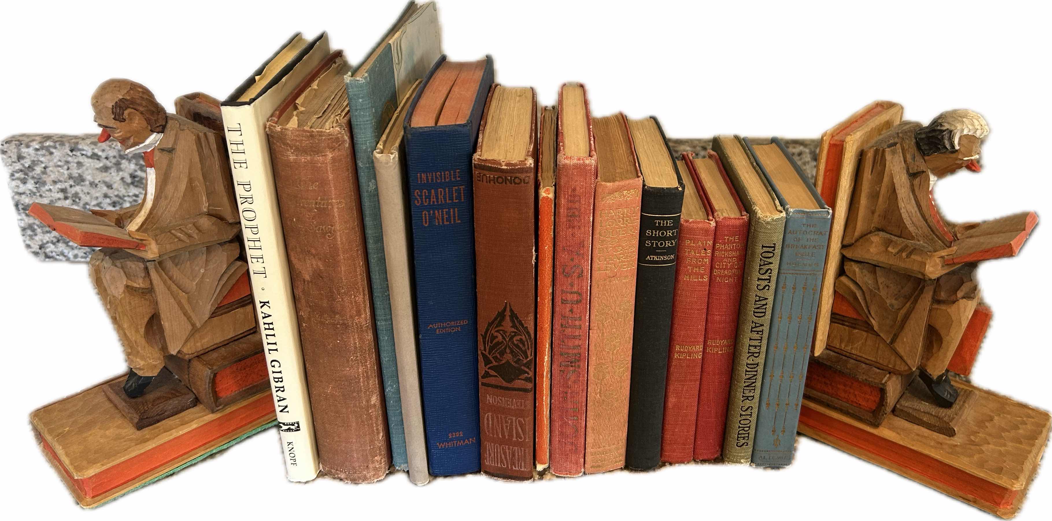 Photo 1 of TWO CARVED WOODEN BOOKENDS W 14 BOOKS