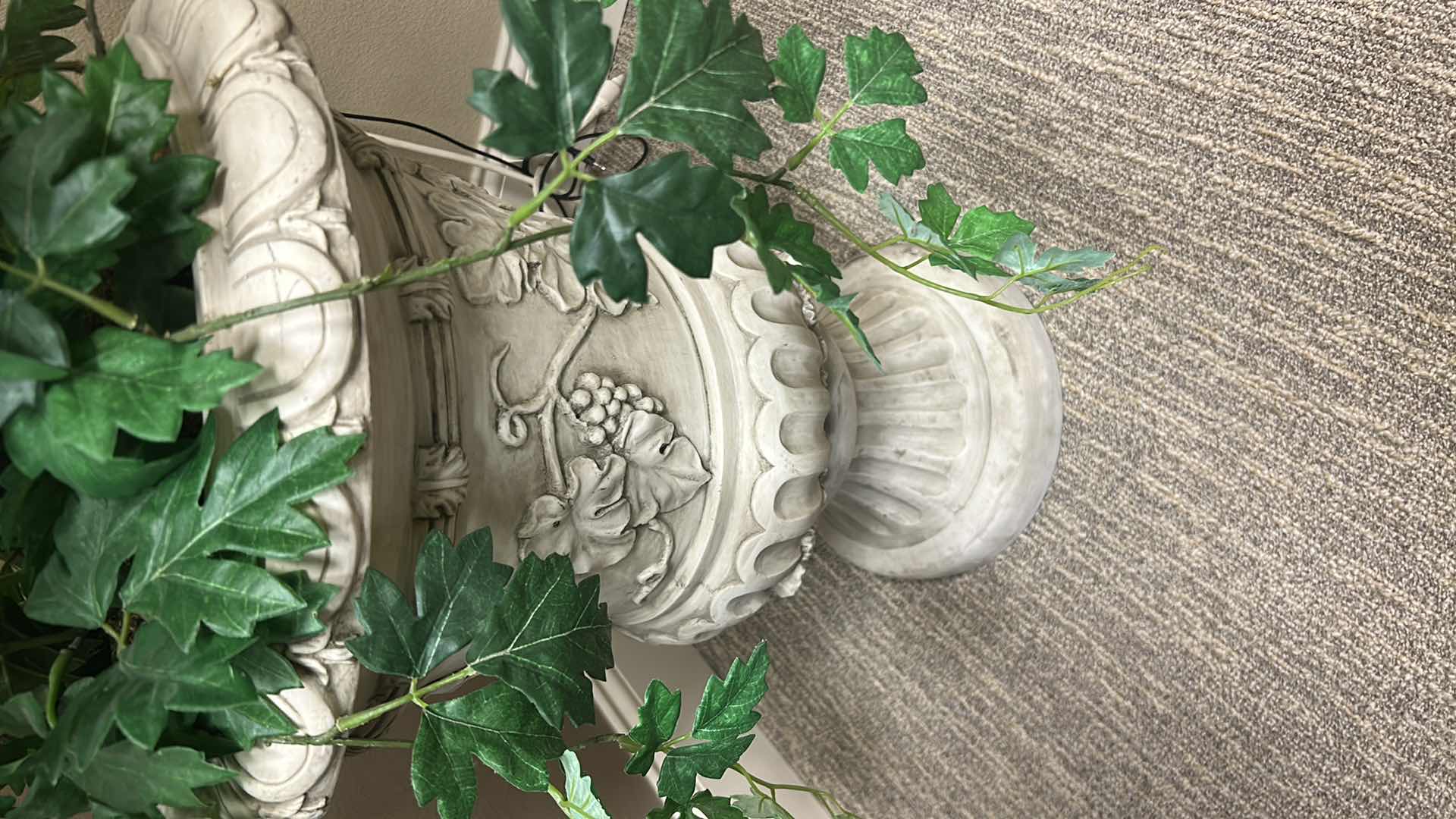 Photo 1 of ARTIFICIAL KENTIA PALM  IN A RESIN DECORATED URN H 75"