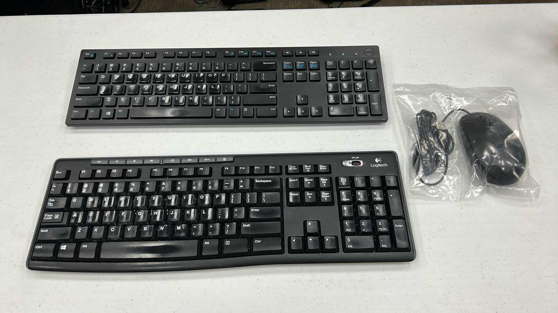 Photo 1 of 2- KEYBOARDS W DELL MOUSE