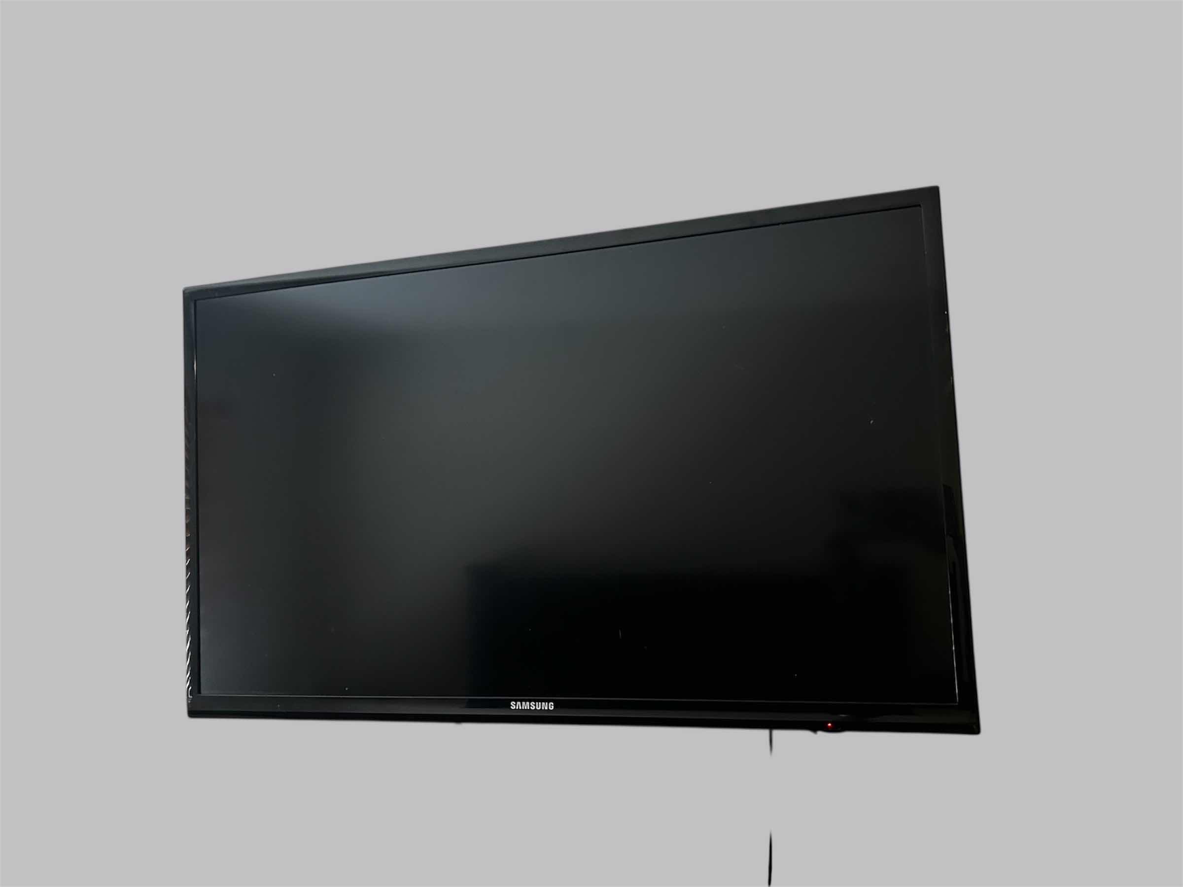 Photo 1 of SAMSUNG 32" WALL MOUNT TV W ROGU AND  REMOTE