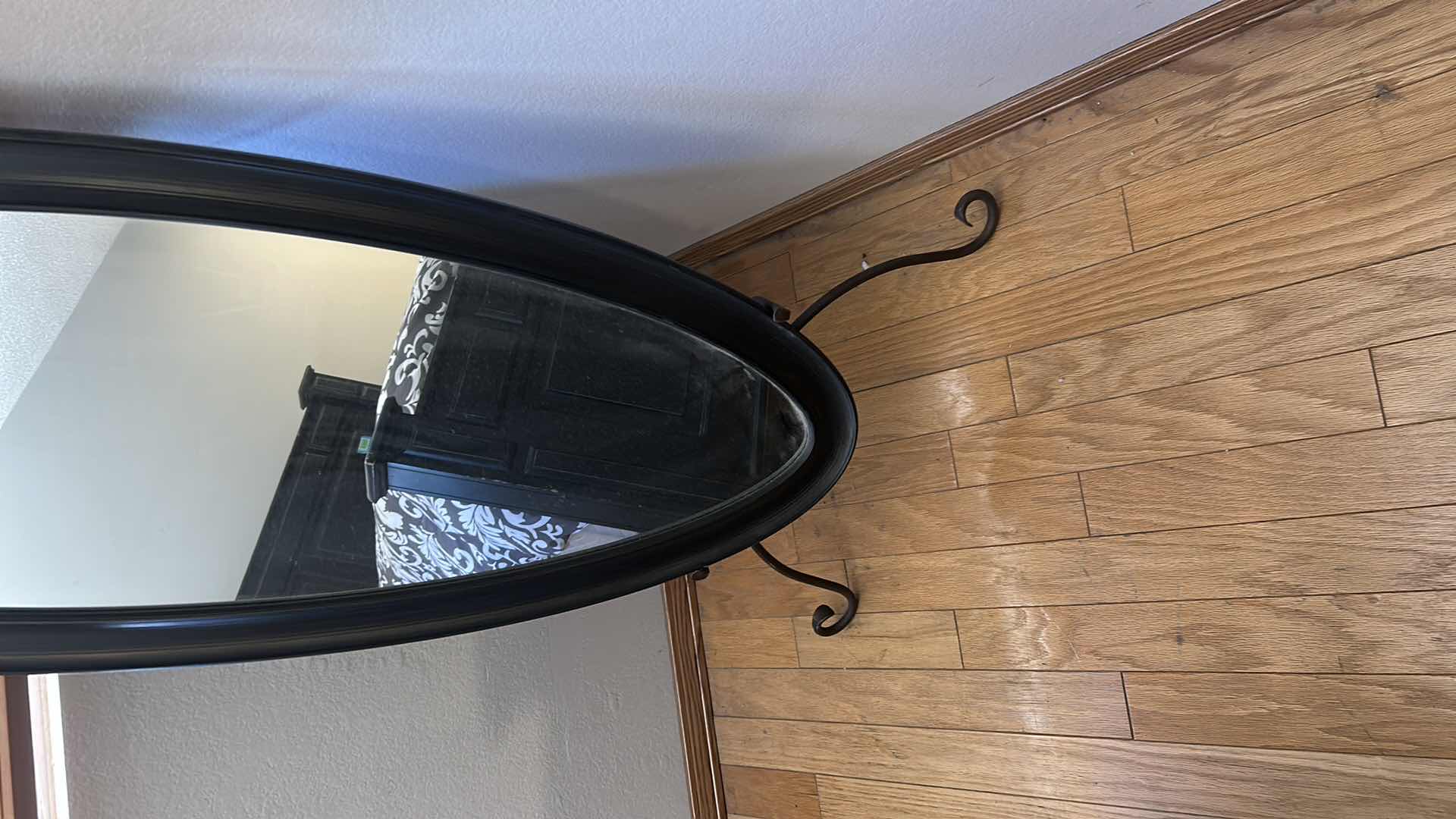 Photo 1 of BLACK OVAL SHAPED CHEVAL FLOOR MIRROR W SCROLL DESIGN STAND 55" X 20"