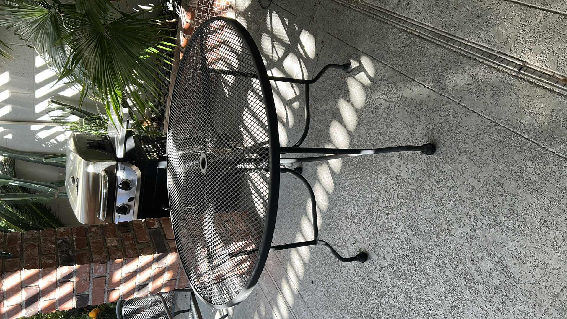 Photo 1 of ROUND BLACK METAL MESH OUTDOOR PATIO TABLE W UMBRELLA HOLE 42"